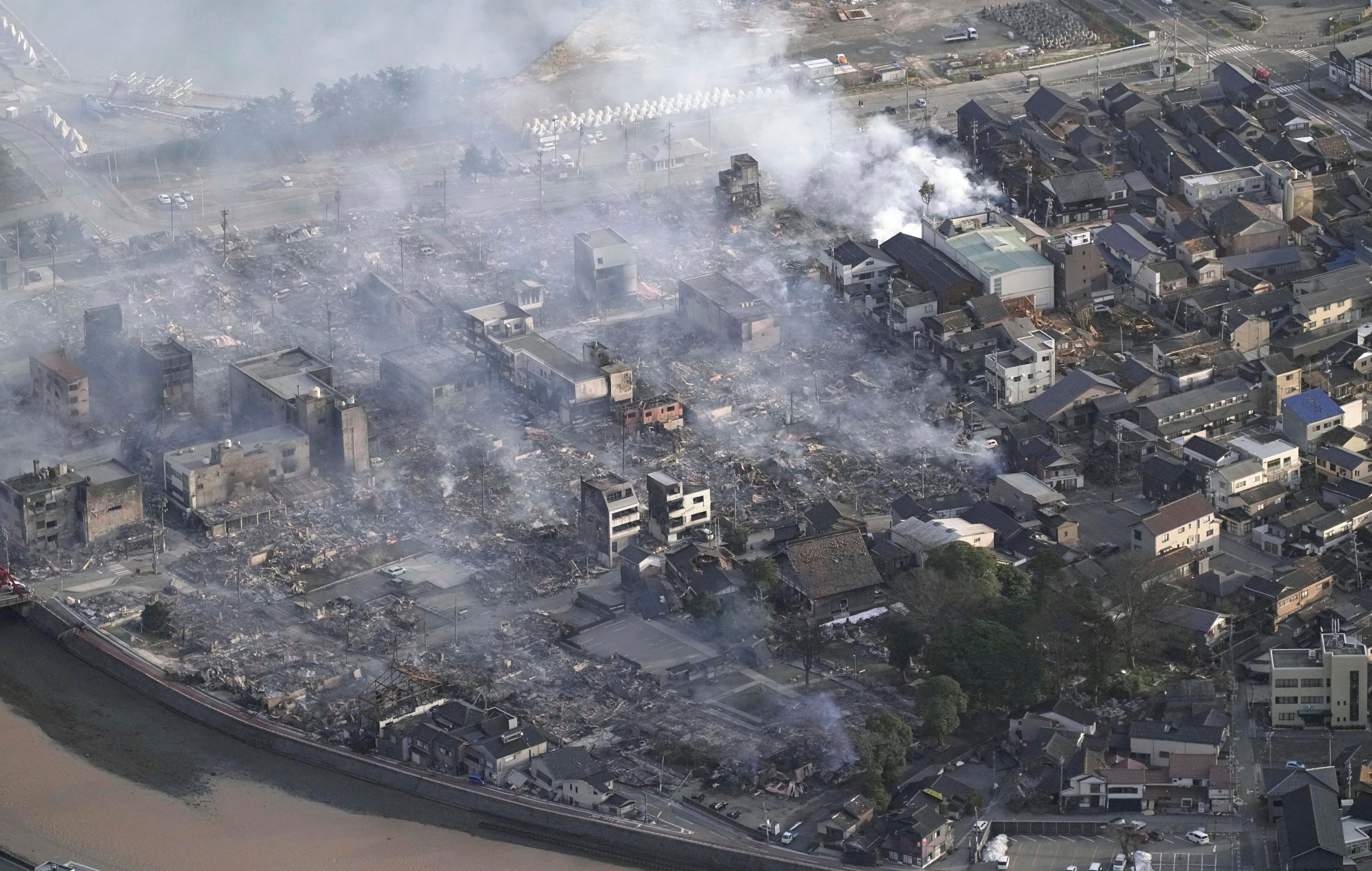 Smoke rises from the site of a fire occurred following an earthquake in Wajima, Ishikawa prefecture