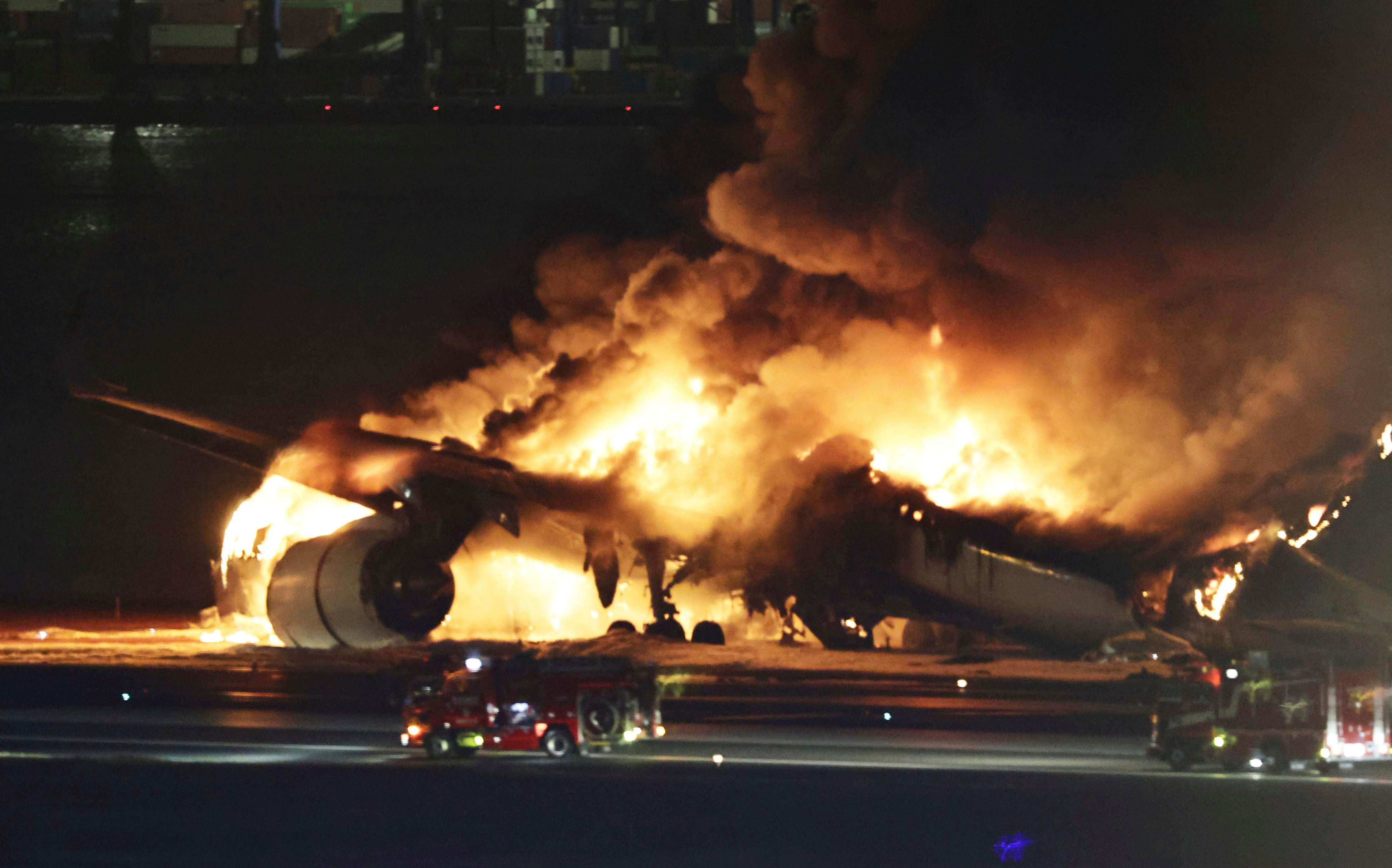 A Japan Airlines plane is on fire on the runway of Haneda airport on Tuesday