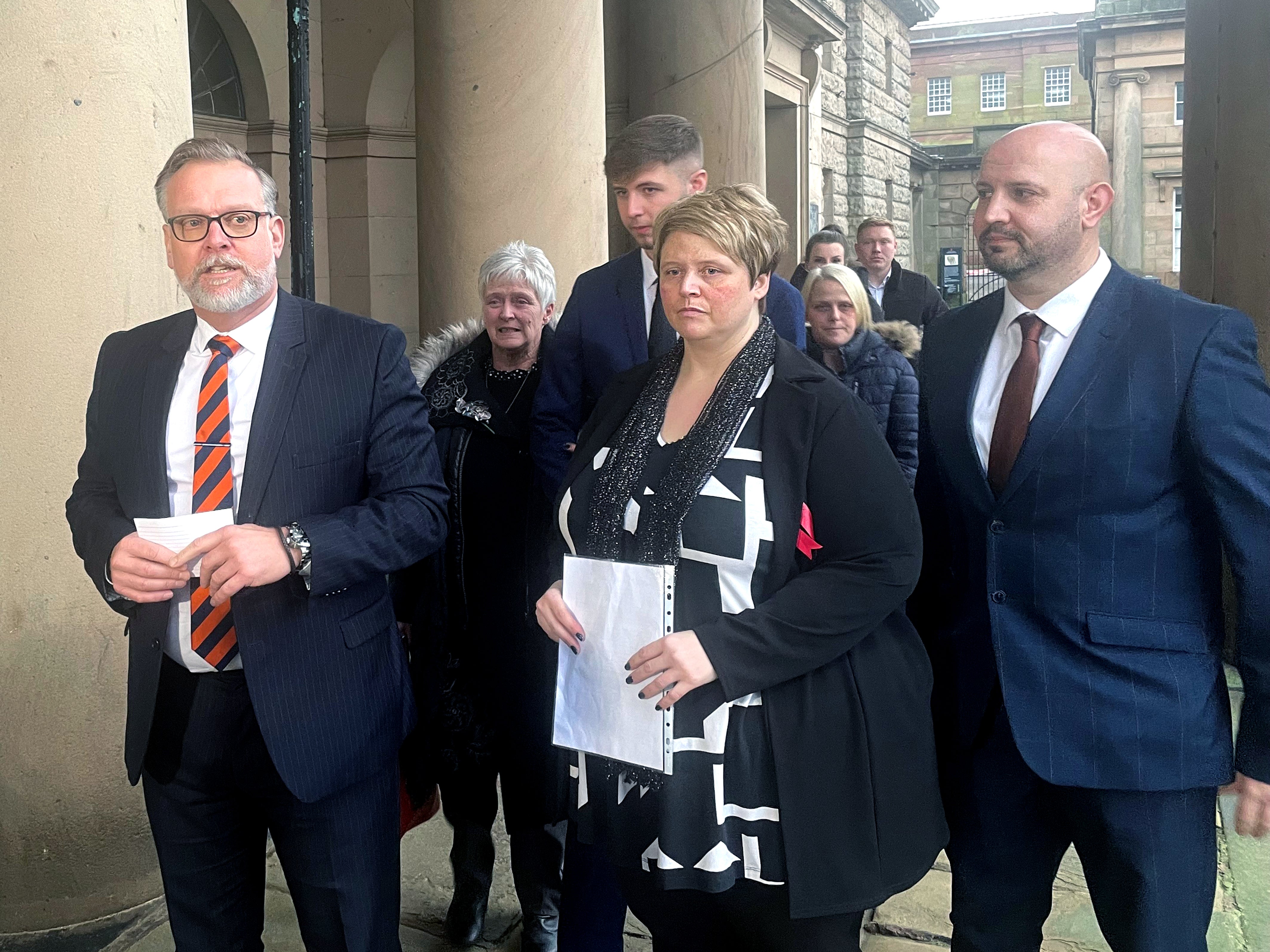 Detective Inspector Nigel Parr of Cheshire Constabulary (left) with Lisa Watson, 44, (centre), mother of murder victim Ryan Watson, alongside family members outside Chester Crown Court