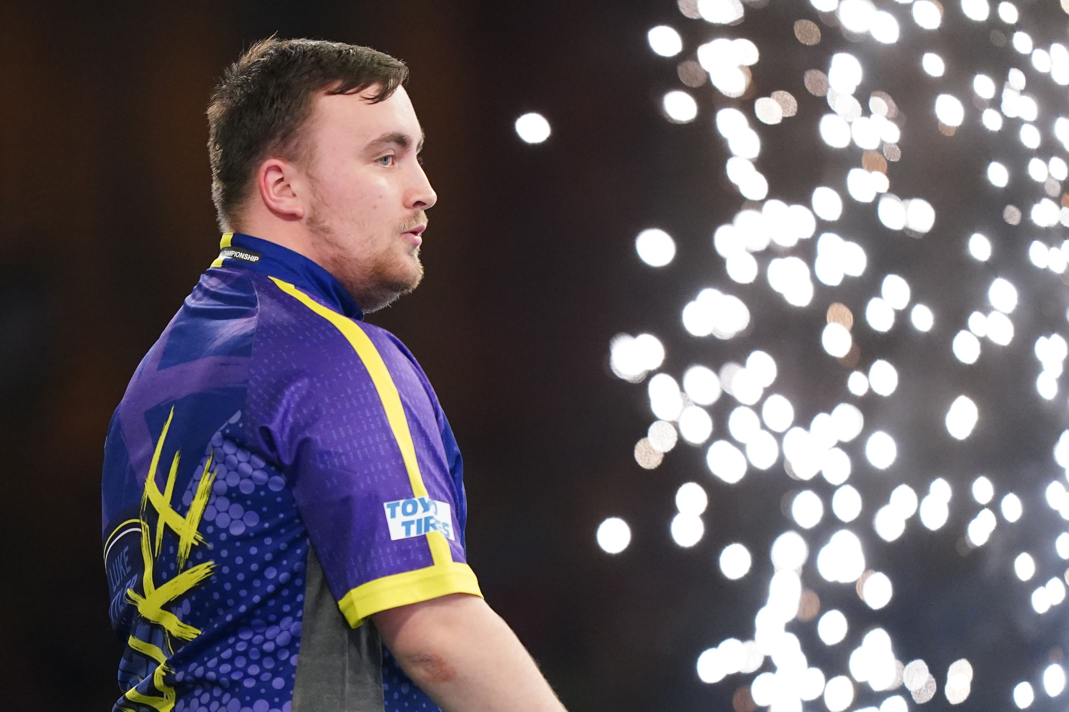 Luke Littler celebrates victory in the semi-final against Rob Cross (Zac Goodwin/PA)