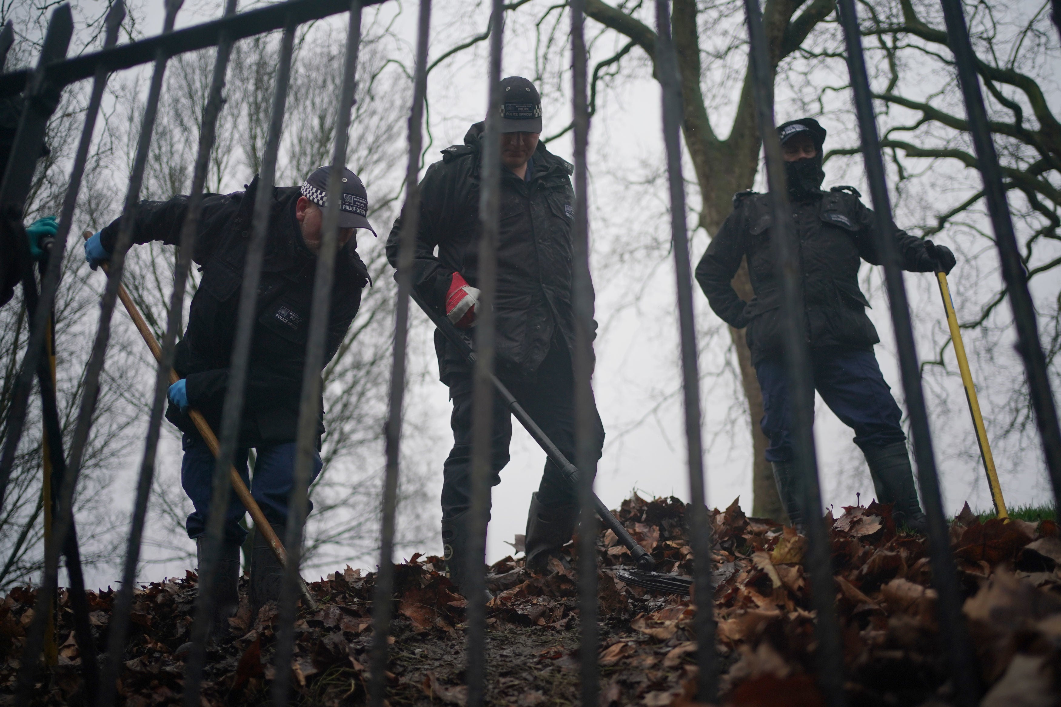 Police officers conduct a search on Primrose Hill in Camden