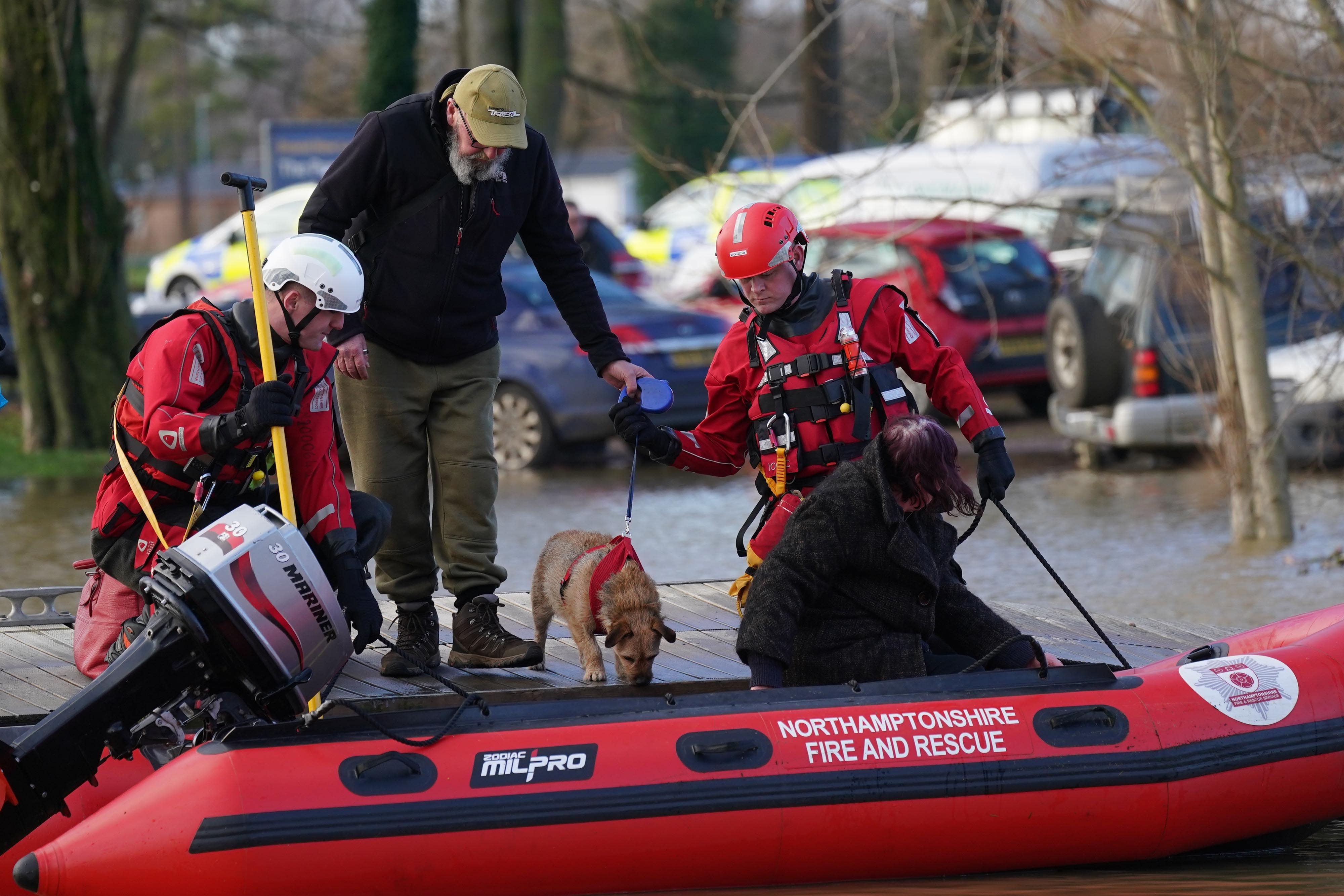 Residents at Billing Aquadrome near Northampton are evacuated from their houseboats after flooding caused by Storm Henk (Jacob King/PA)