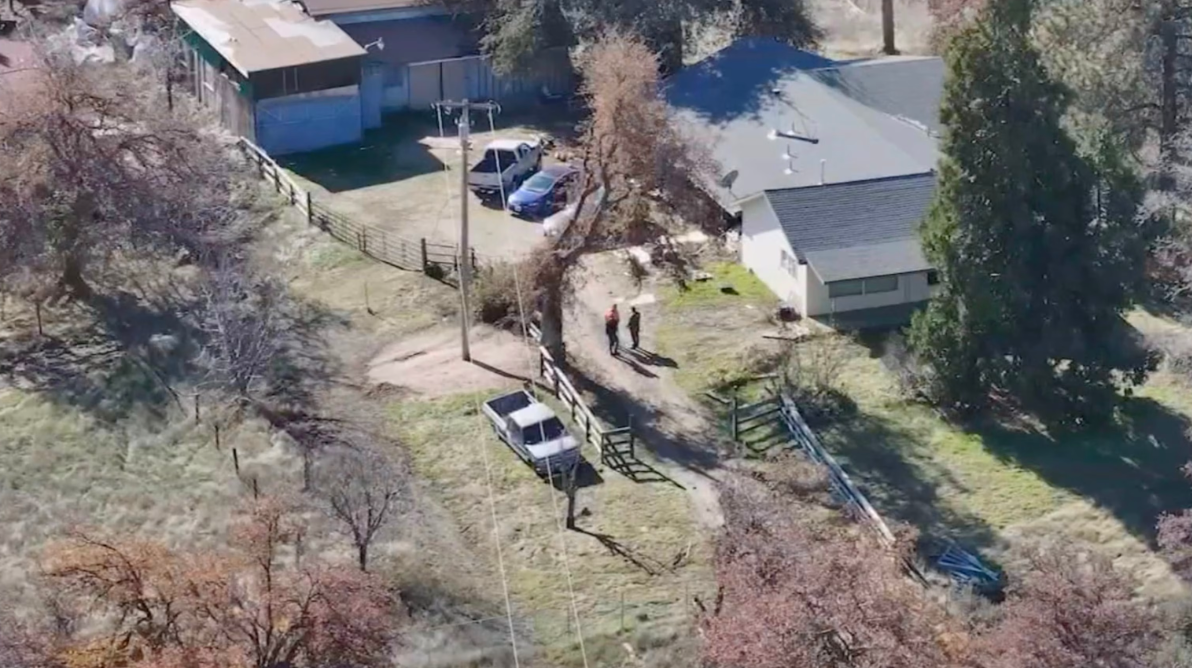 Law enforcement at the scene after a 14-year-old boy was arrested for allegedly murdering his parents and injuring his 11-year-old sister