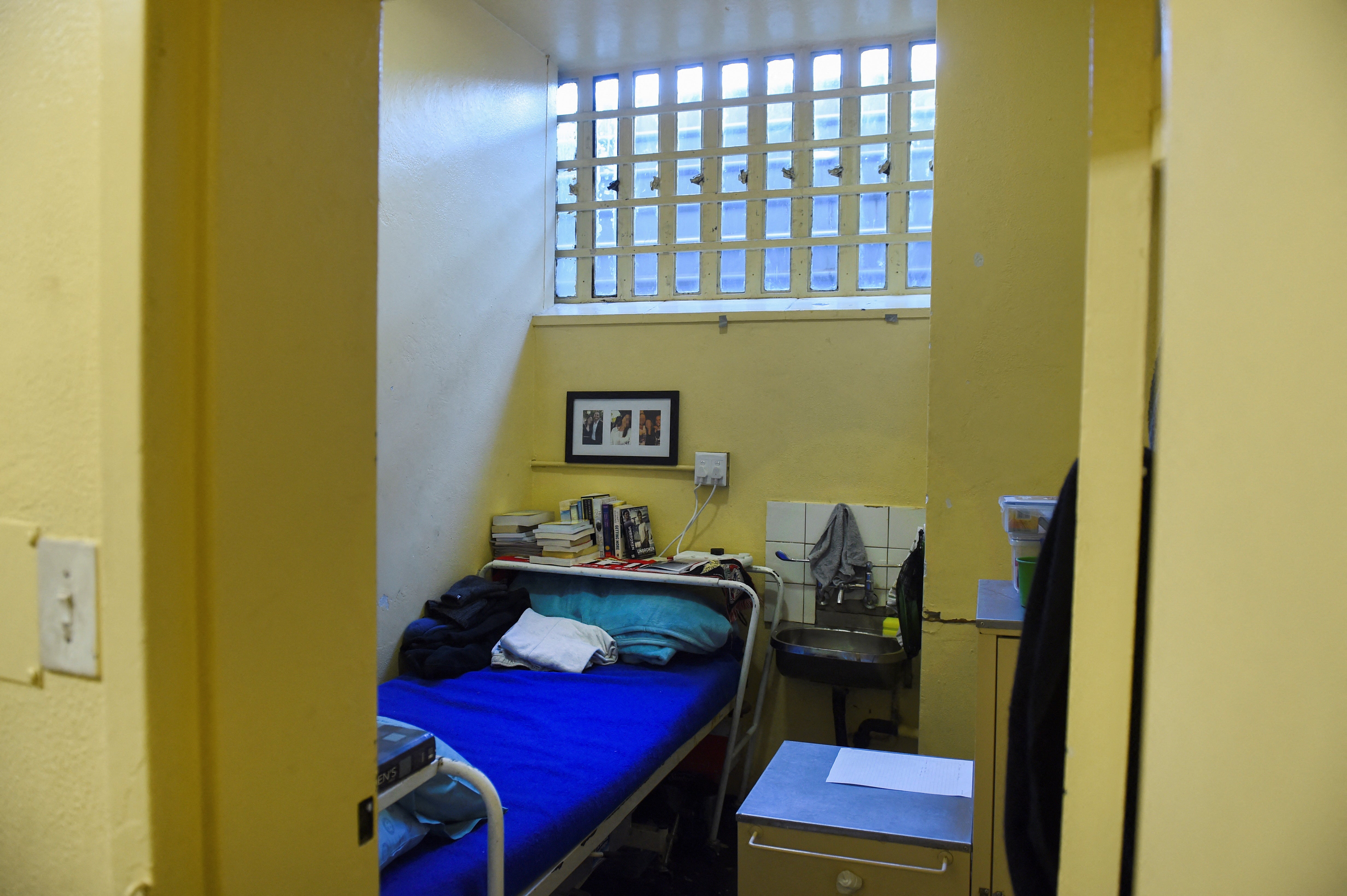 Religious and self help books can be seen stacked above Pistorius’s bed