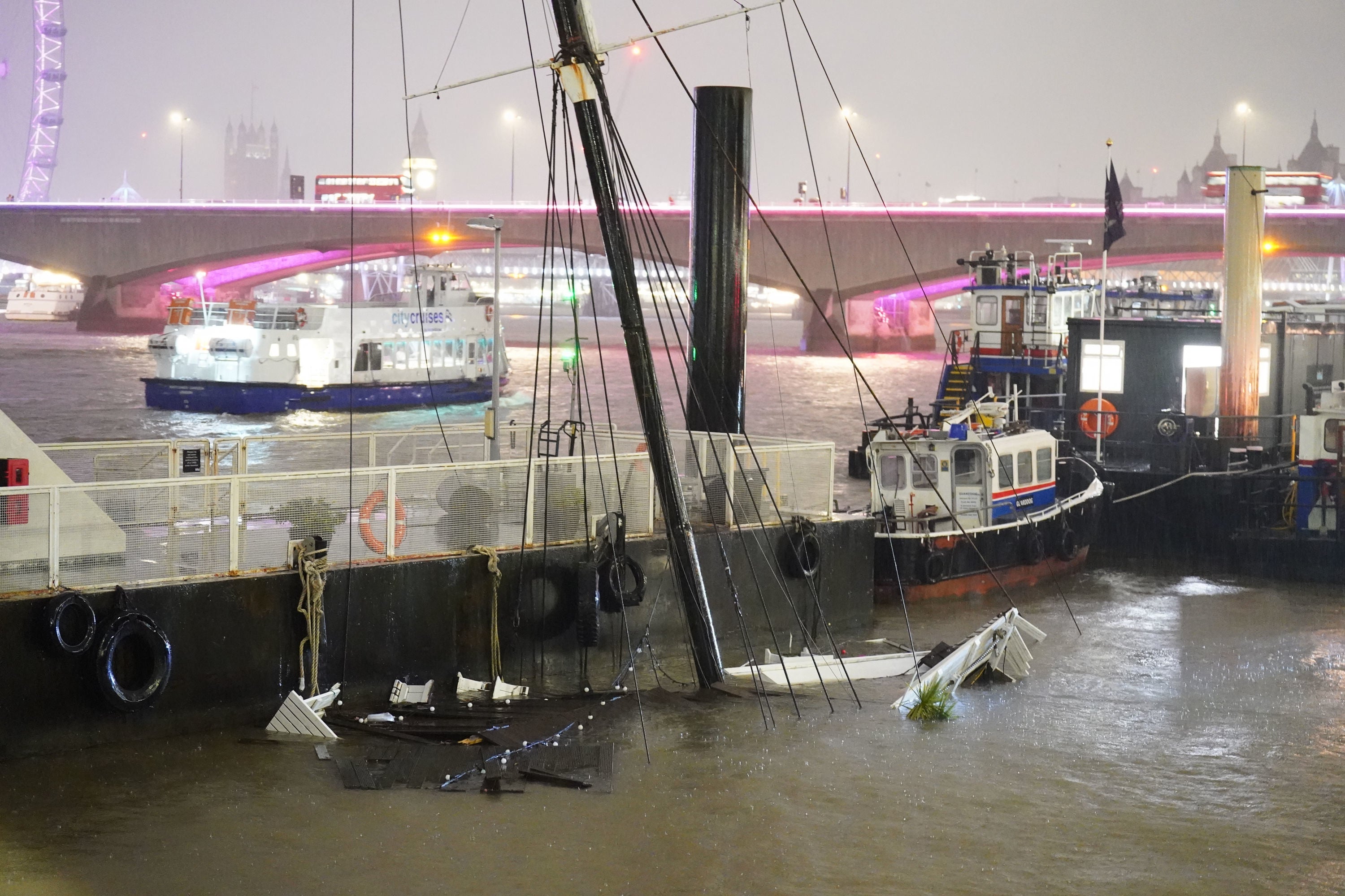 The mast of the ship can be seen