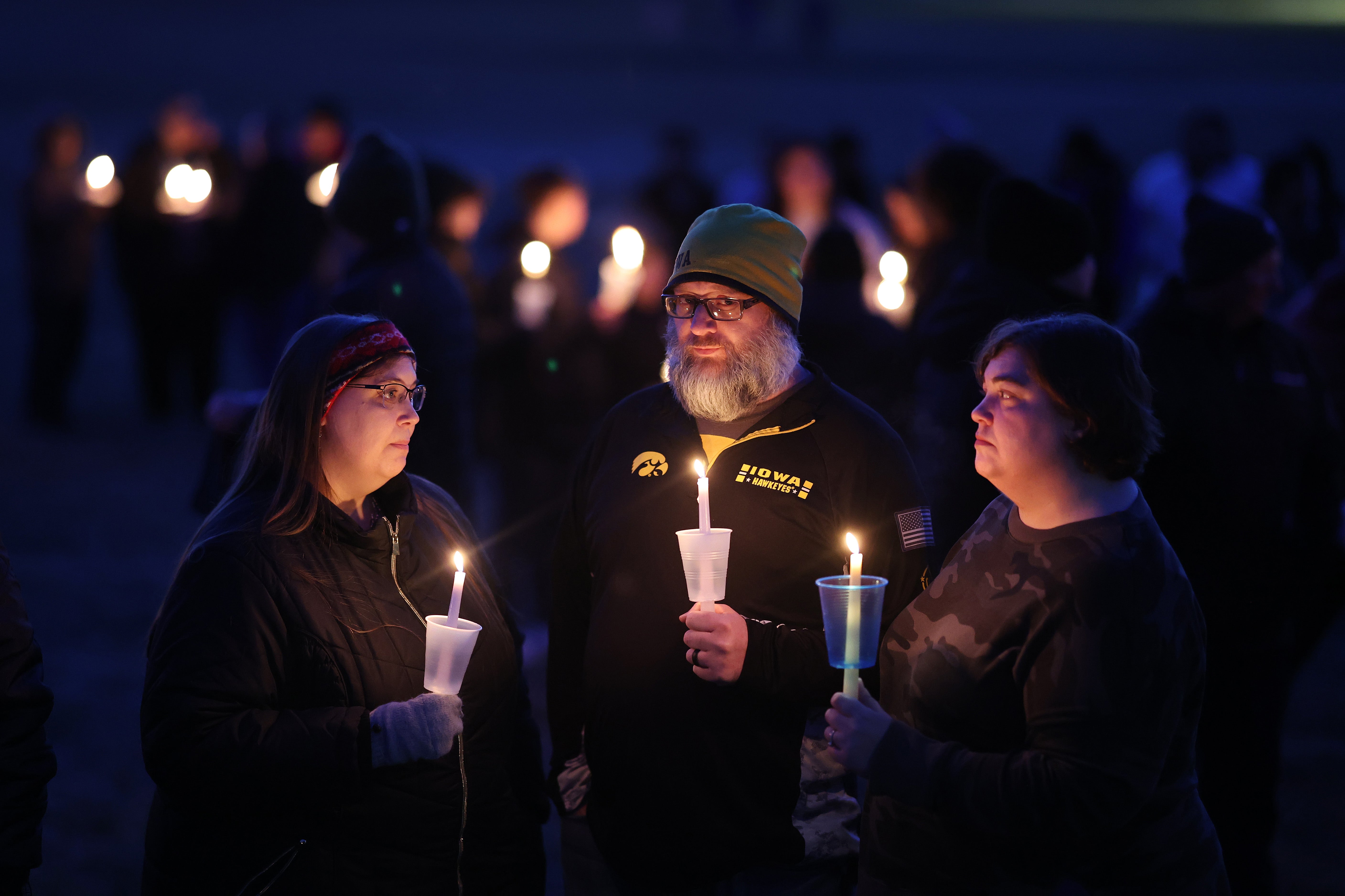 Community members gather in Wiese Park for a candlelight vigil