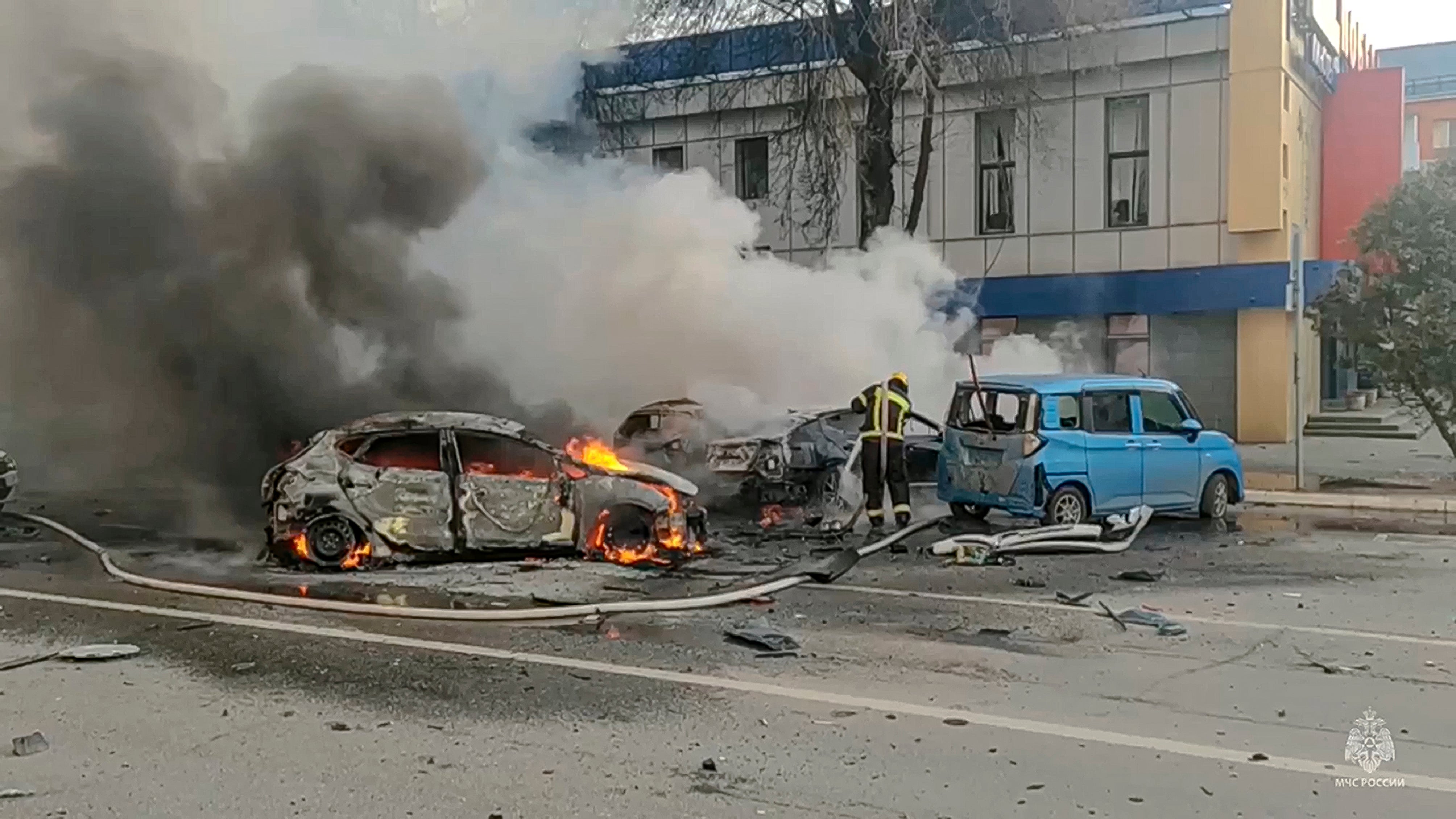 Russian firefighters tackle a fire in Belgorod after a Ukrainian drone attack