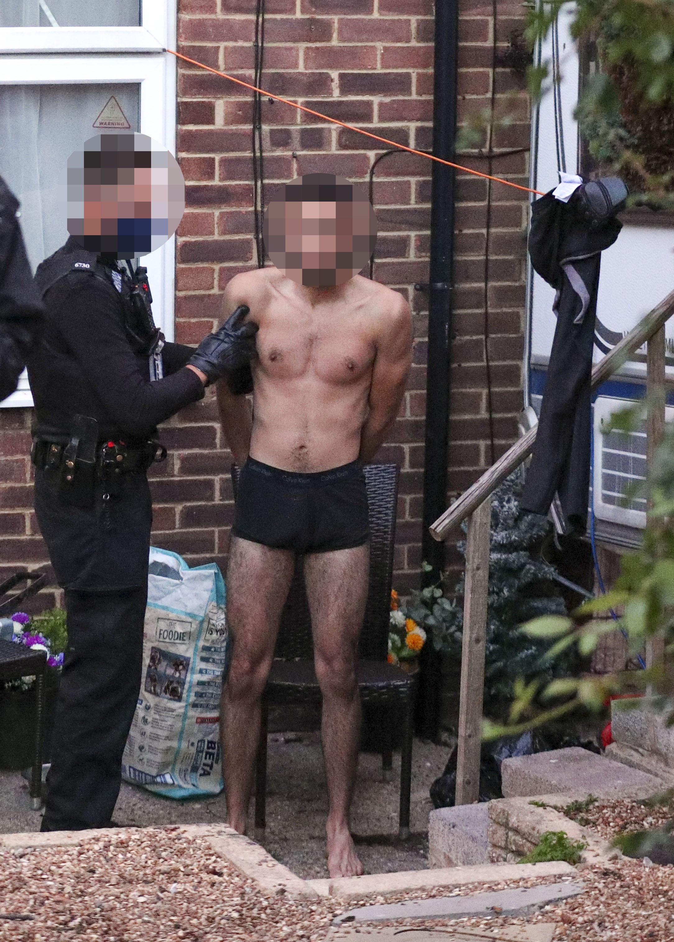 Thames Valley Police lead a man out of his home in one of many busts