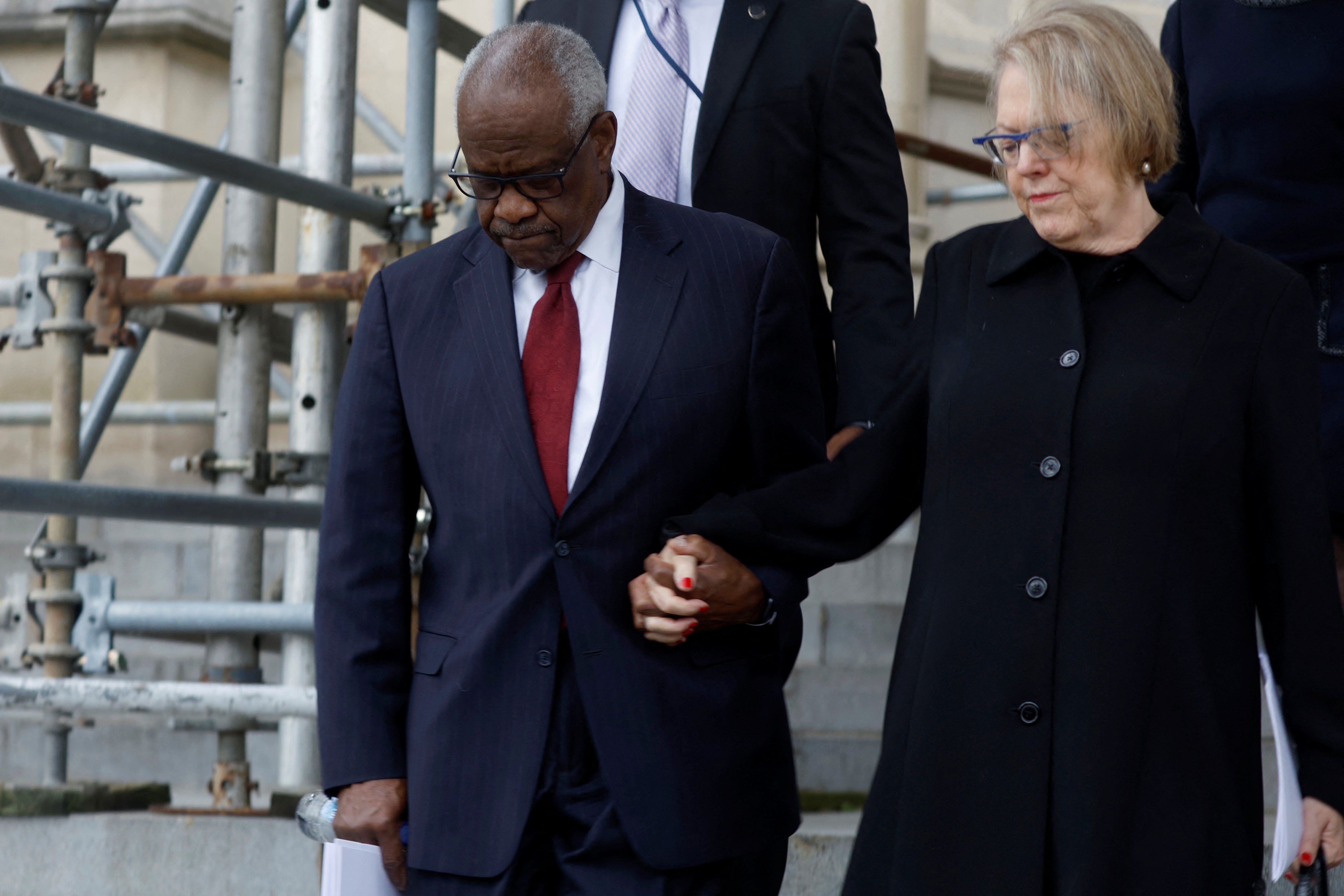 House Democrats have urged Supreme Court Justice Clarence Thomas, left, to recuse himself from a case involving Donald Trump’s ballot eligiblity, citing his wife, Ginni Thomas, right, who promoted false election claims.