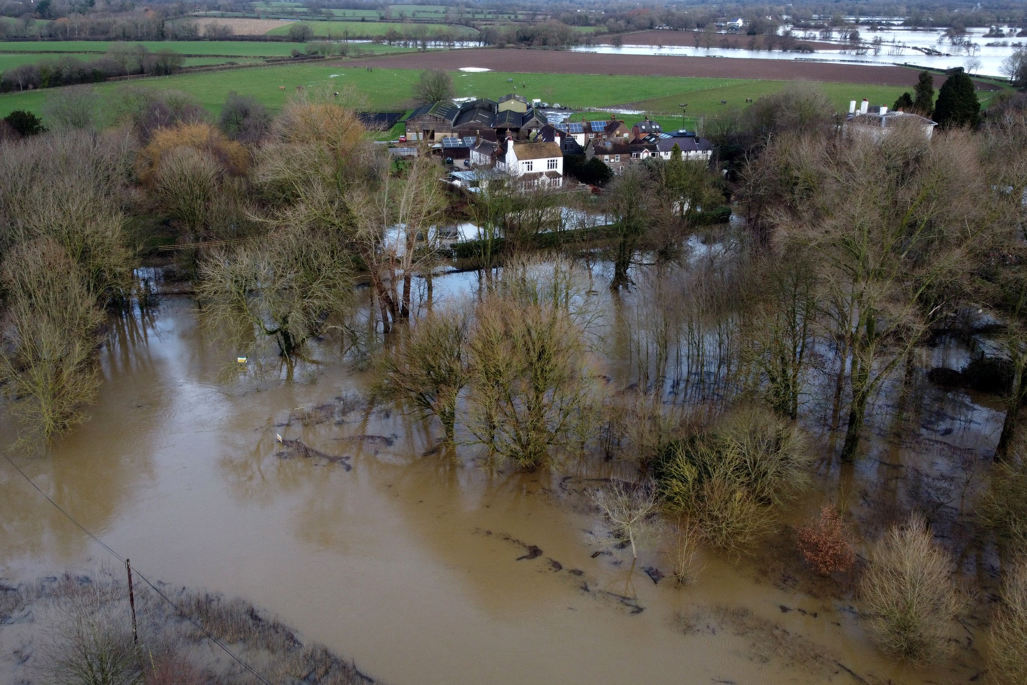 Flood waters from the River Ouse approach properties in Barcombe Mills, East Sussex. (Gareth Fuller/PA)