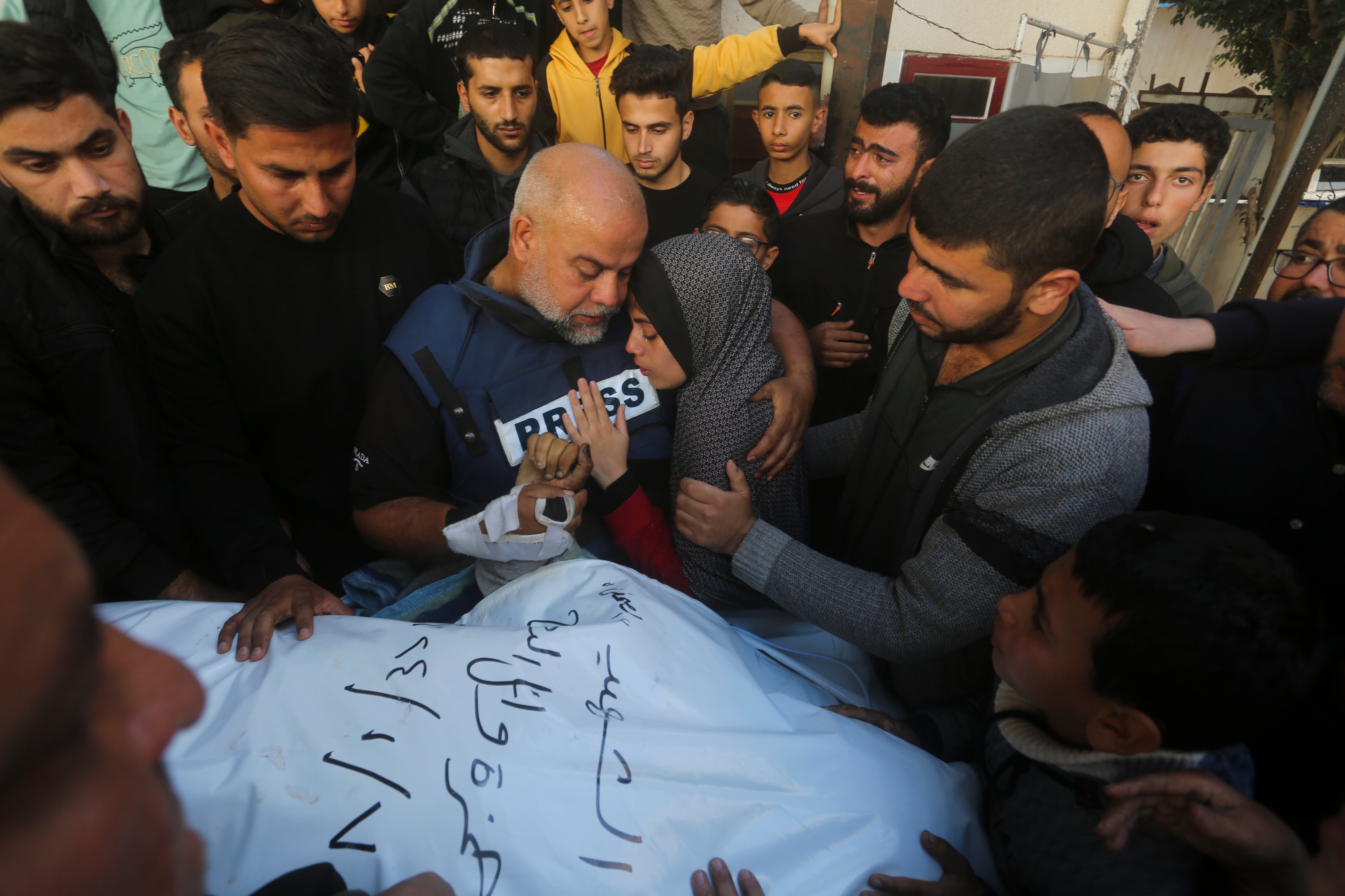 Al Jazeera journalist Wael Dahdouh holds the hand of his son who was killed by Israel in Rafah in January 2024