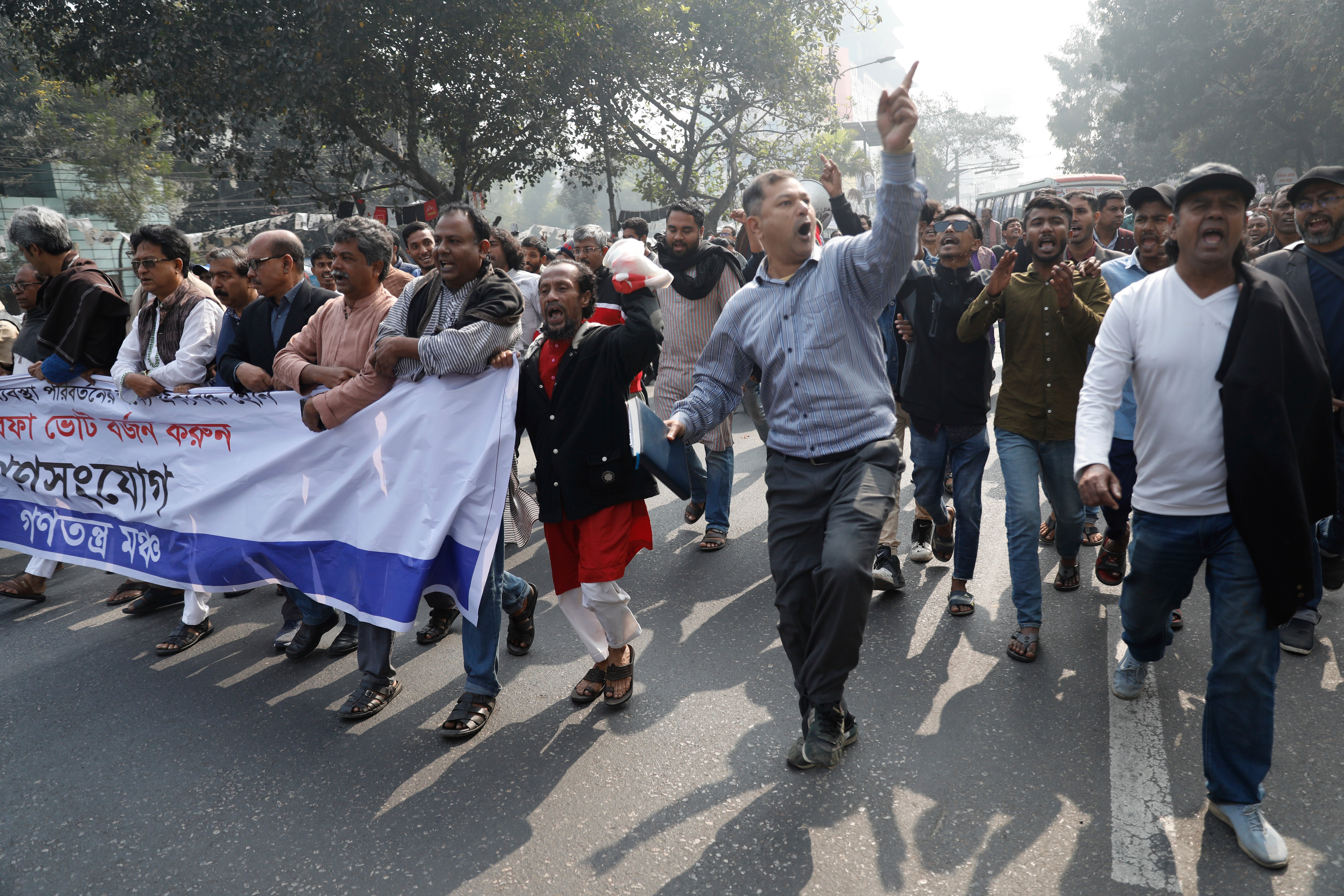 Gono Odhikar Porishod supporters hold a protest against the election boycott call by the main opposition party, and demanded for free and fair elections