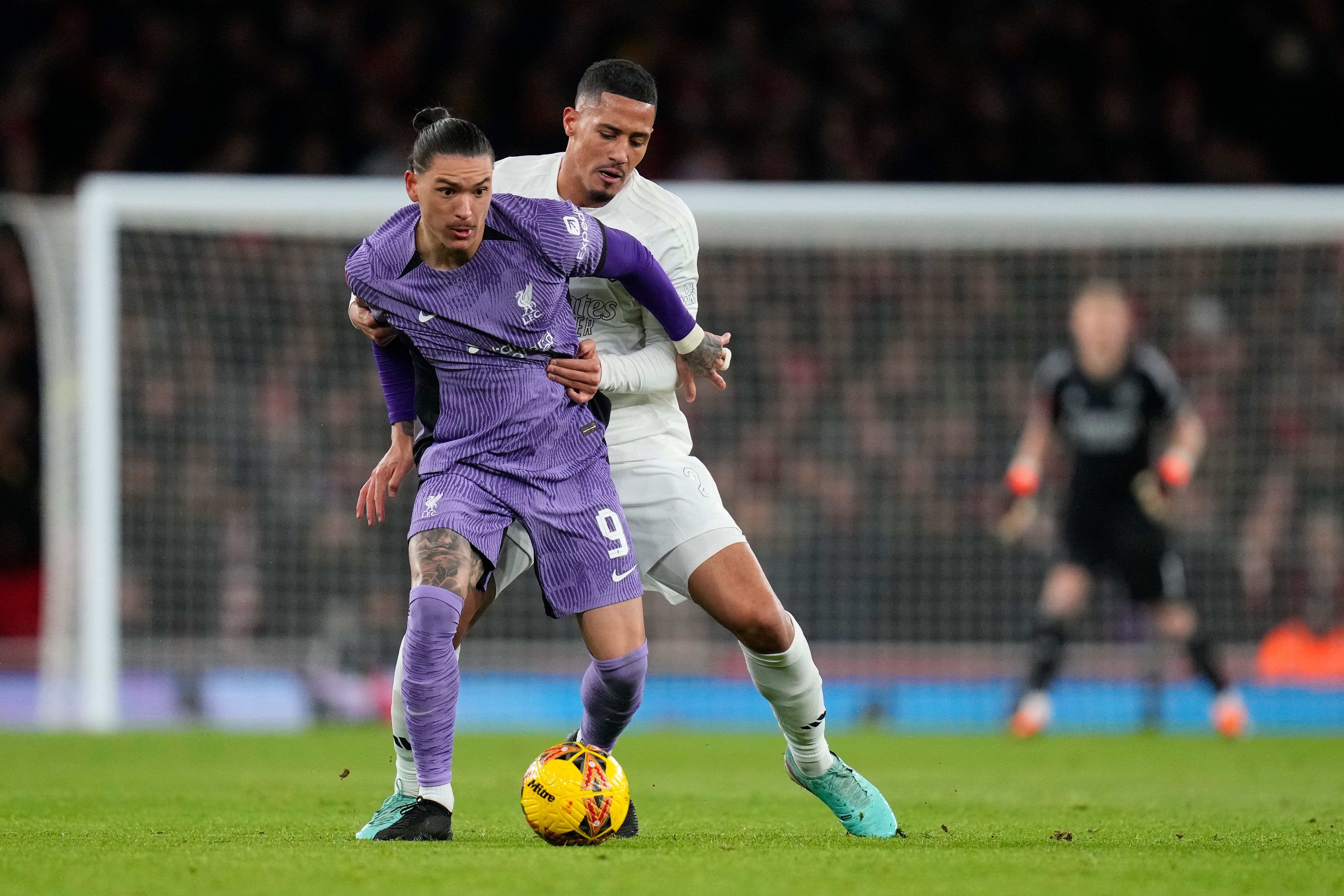 Arsenal’s William Saliba battle for the ball with Darwin Nunez in the 2-0 loss to Liverpool (Kirsty Wigglesworth/AP/PA)