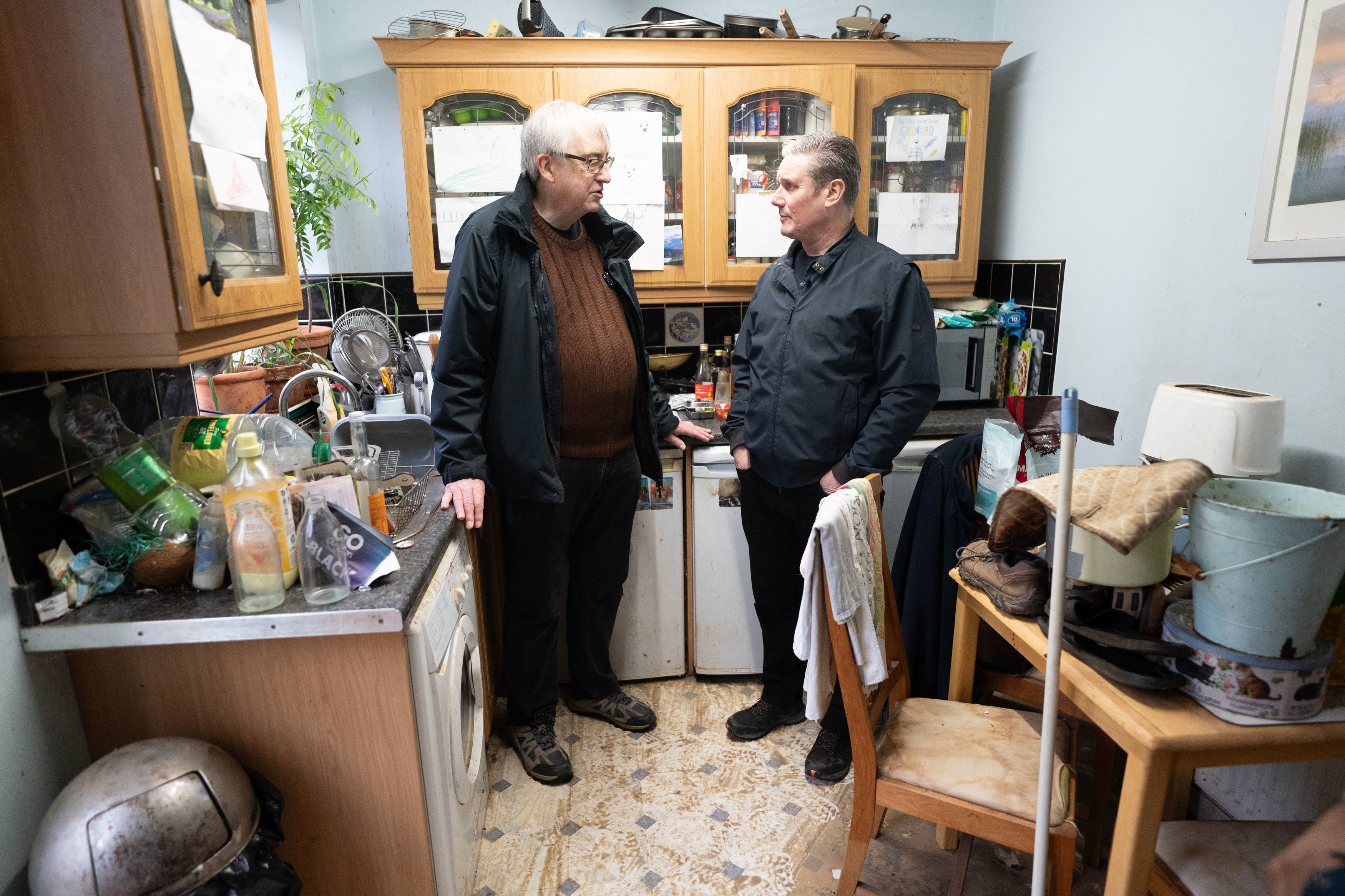 Keir Starmer meets Ian Clement whose house in Loughborough, East Midlands flooded