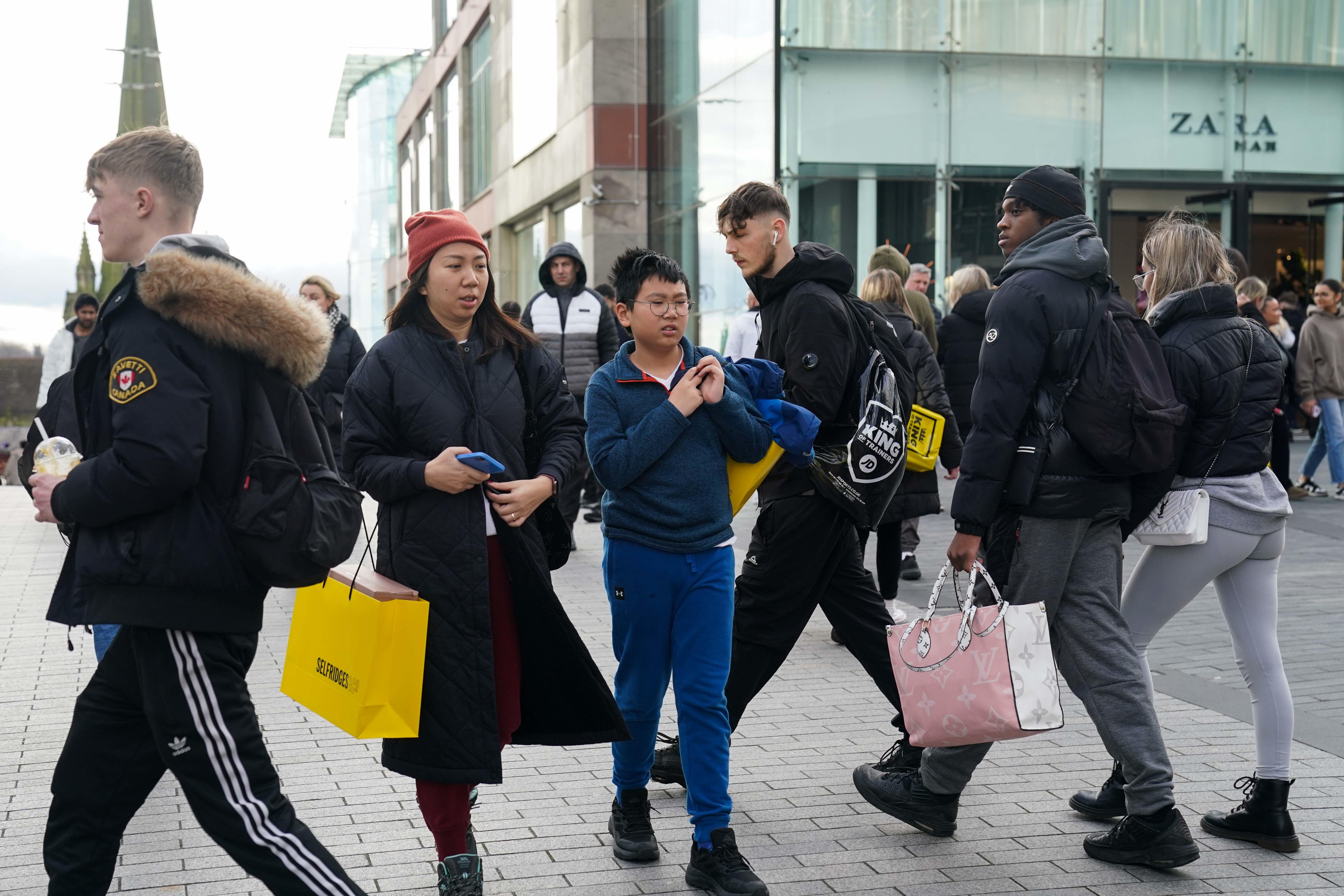 Shoppers near the Bullring shopping centre in Birmingham (PA)