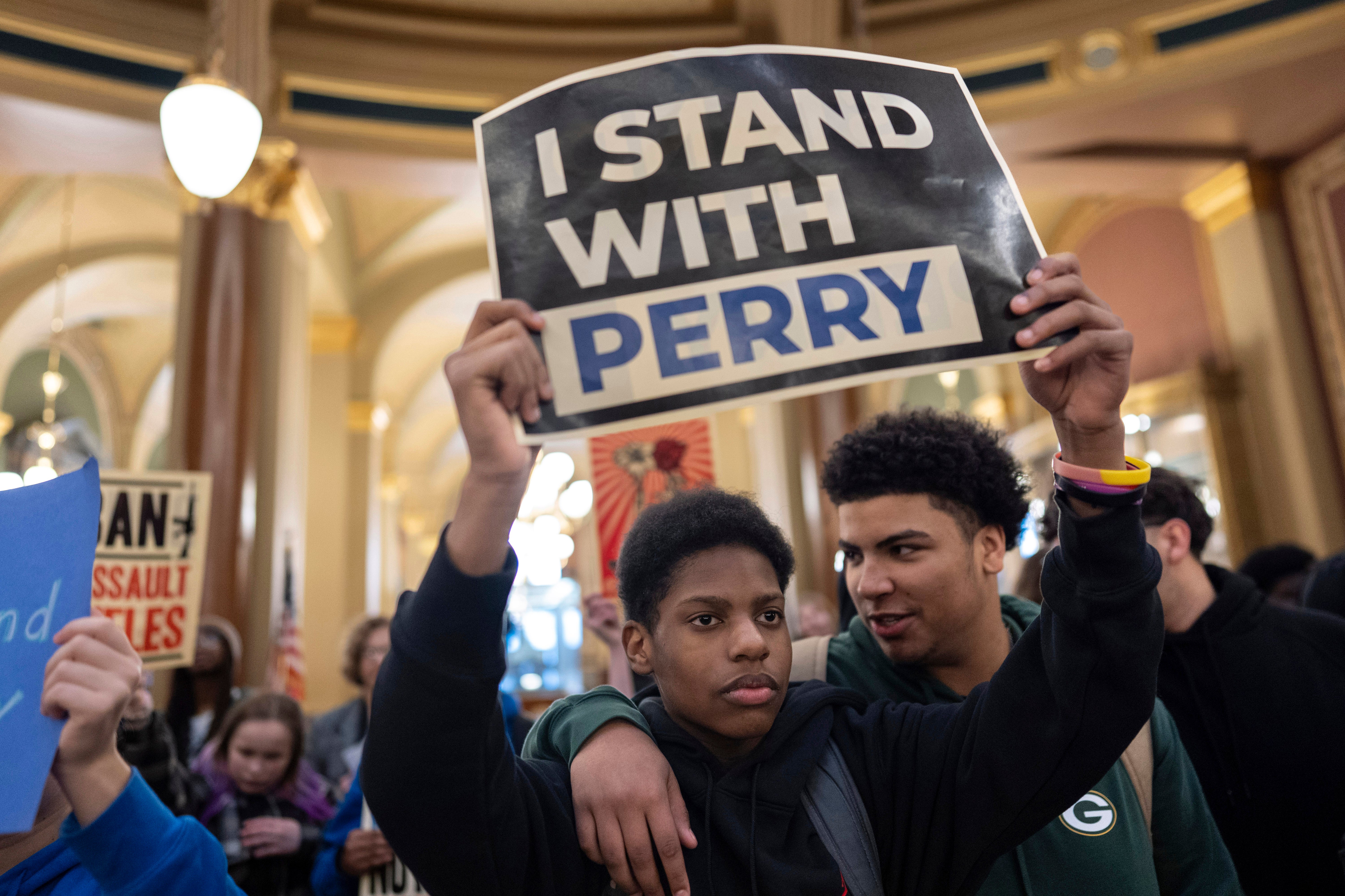 Students and supporters gather in the rotunda to protest gun violence during the opening day of the Iowa Legislature