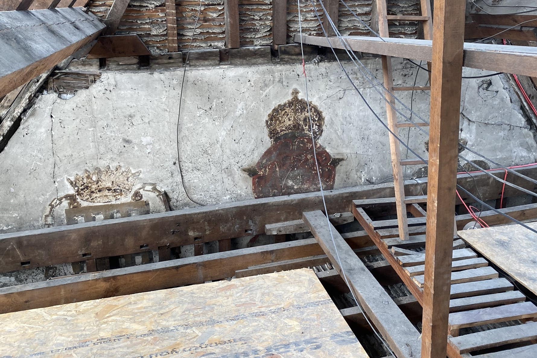 Rare medieval wall paintings have been uncovered at Christ’s College Cambridge by builders working in a roof space (Tobit Curteis Associates LLP/PA)