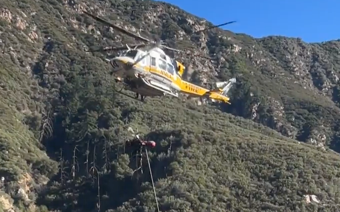 A woman survived four nights trapped in her vehicle after she crashed her pickup truck in a mountain area near Mount Baldy in Los Angeles County