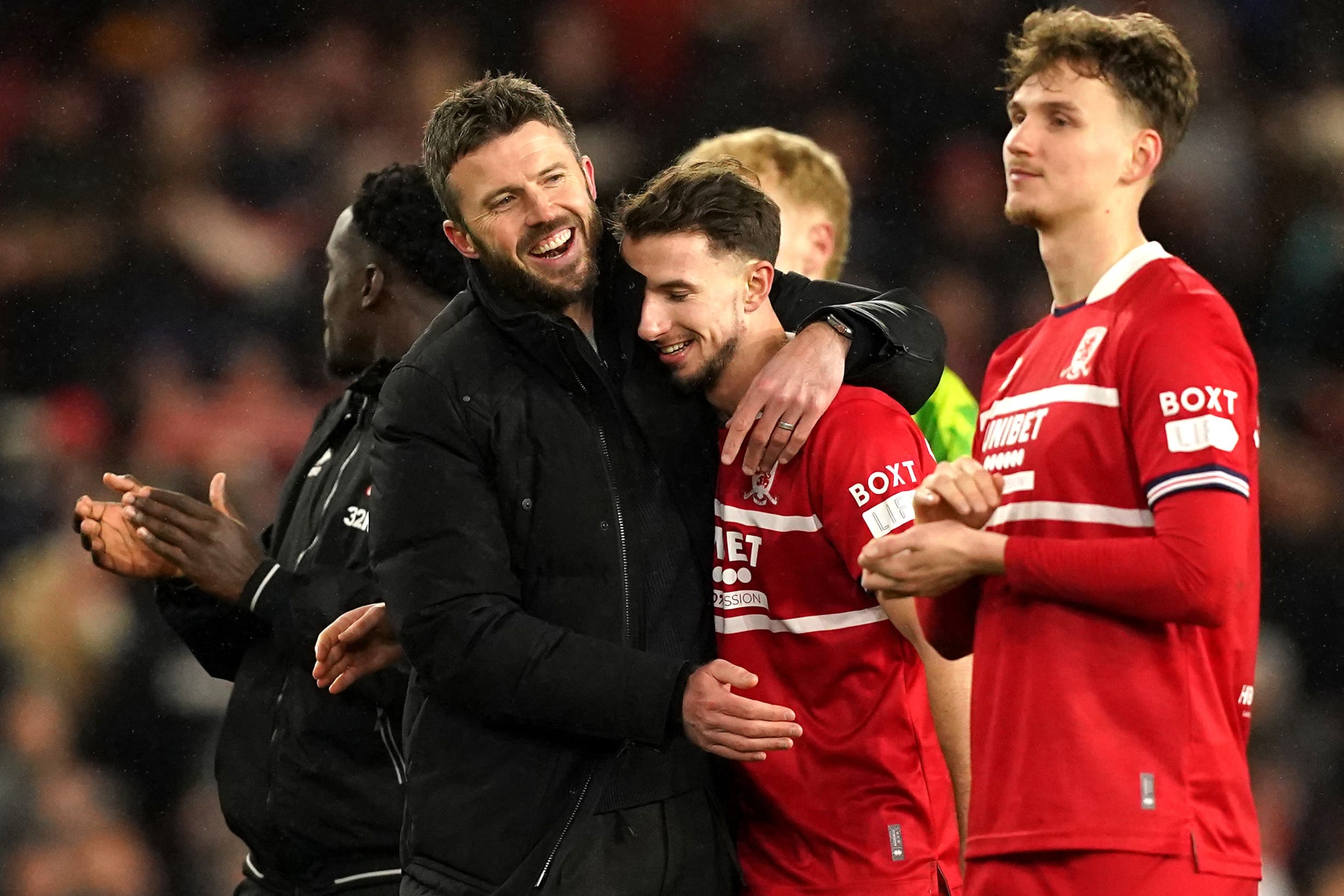 Michael Carrick, left, celebrates with his players after victory over Chelsea (Martin Rickett/PA)