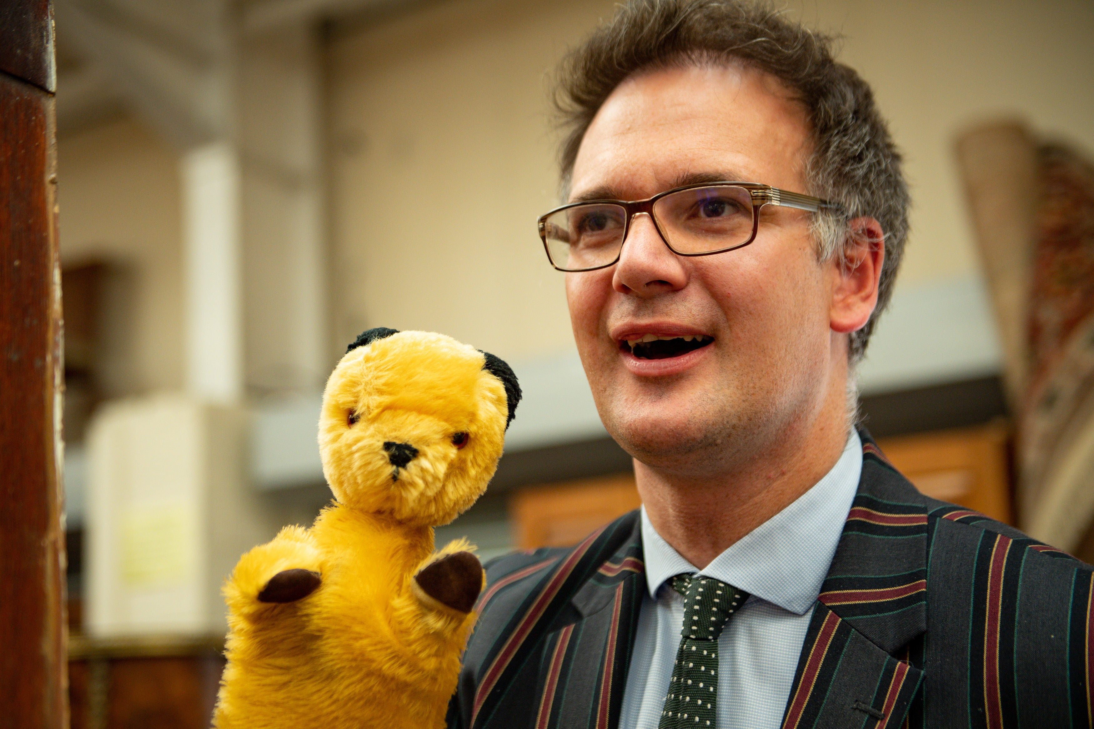 TV auctioneer Charles Hanson pictured with an original Sooty puppet in 2019