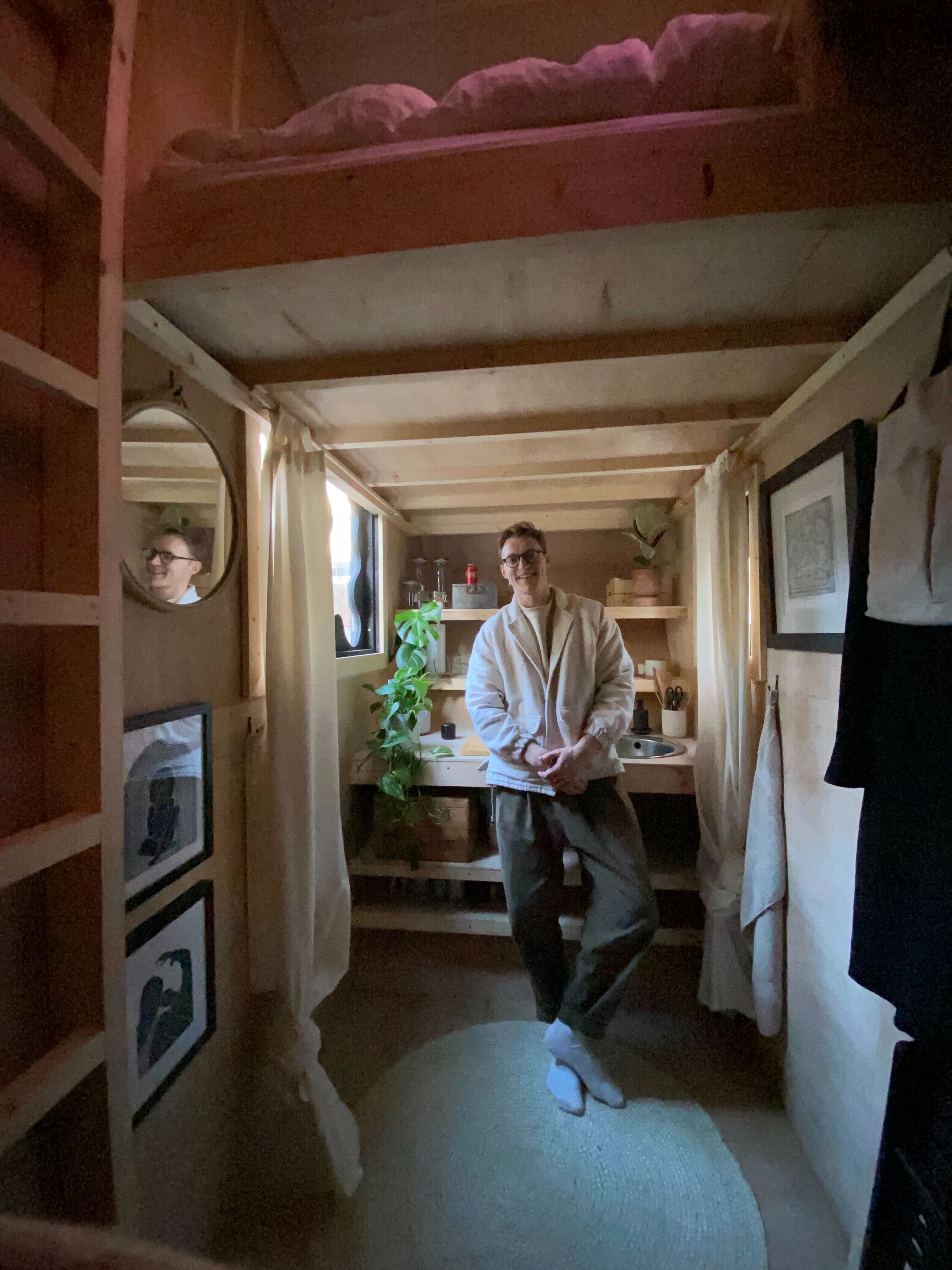 Harrison Marshall inside his skip house