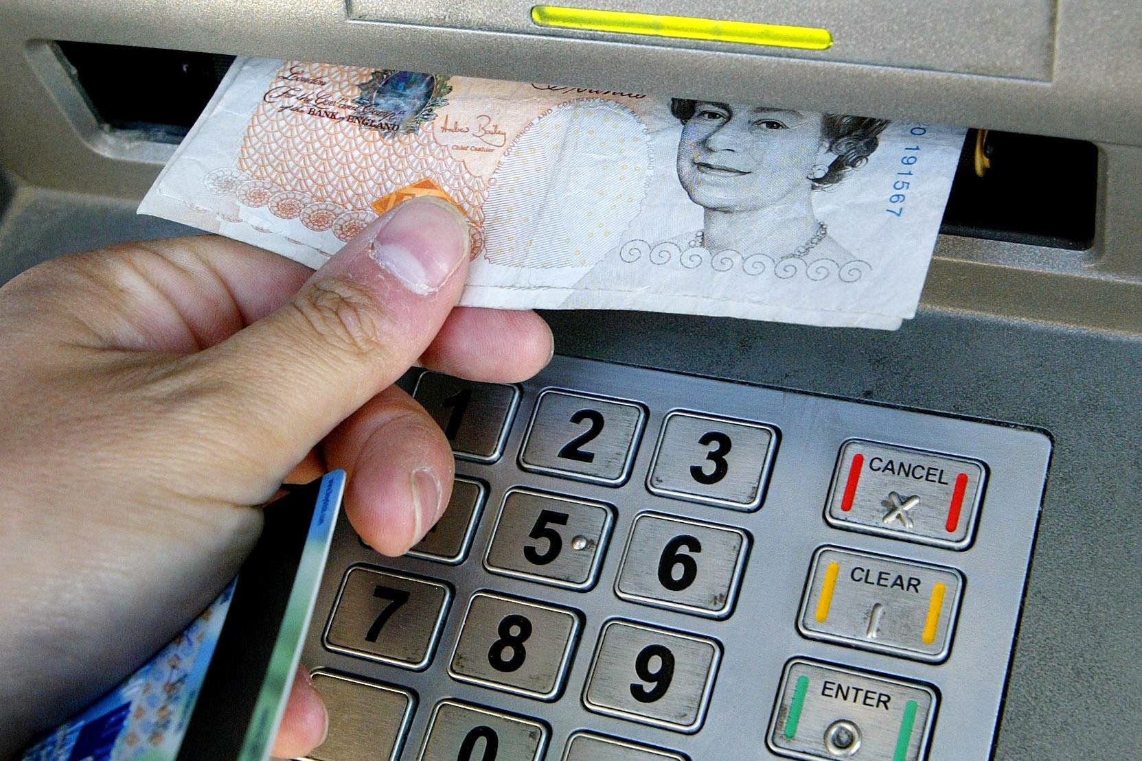 The average UK adult withdrew around £1,500 from cash machines last year, according to data from ATM and cash access network Link (Gareth Fuller/PA)