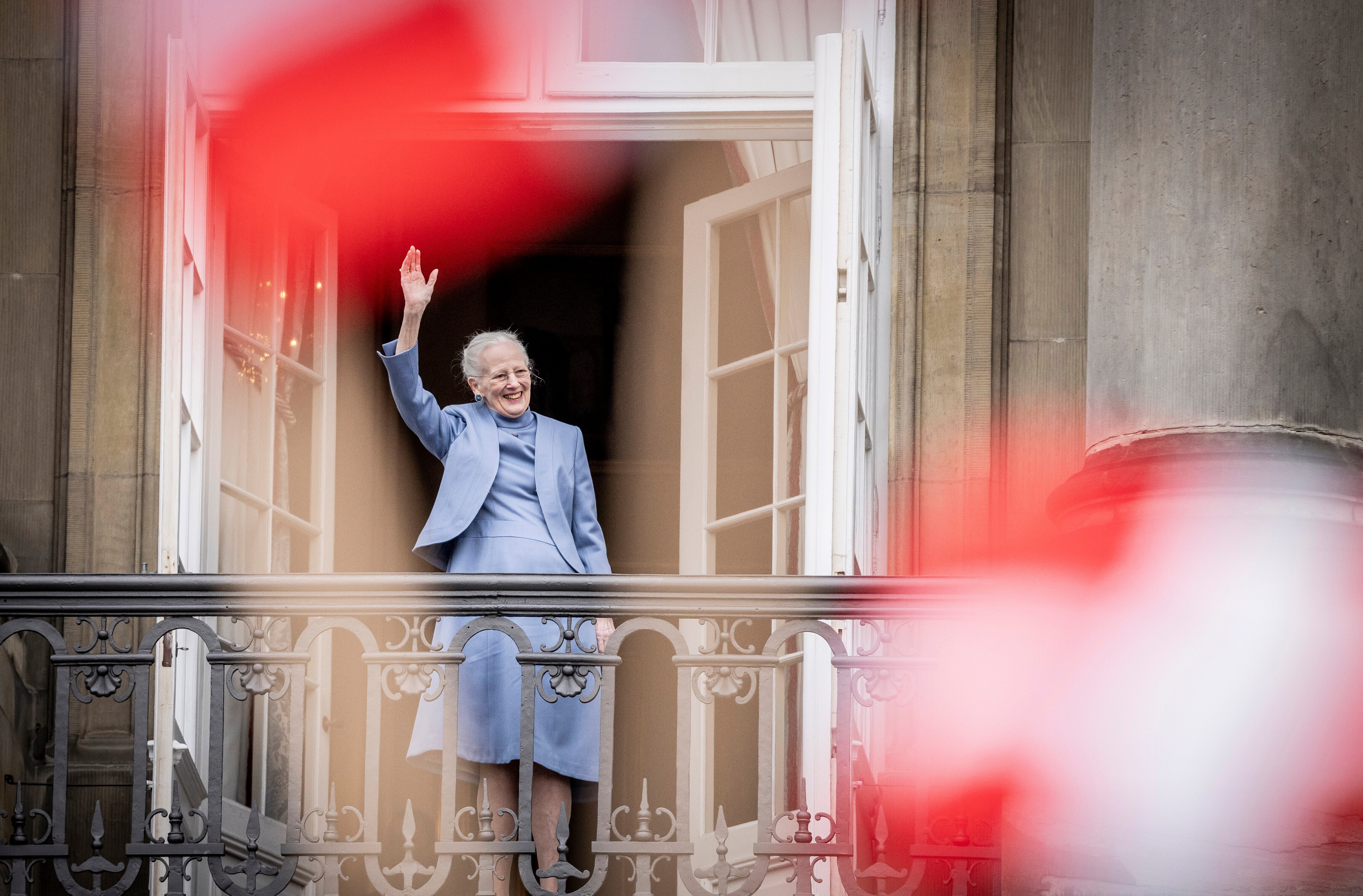 Denmark’s Queen Margrethe II waves from the balcony during celebrations for her 83rd birthday