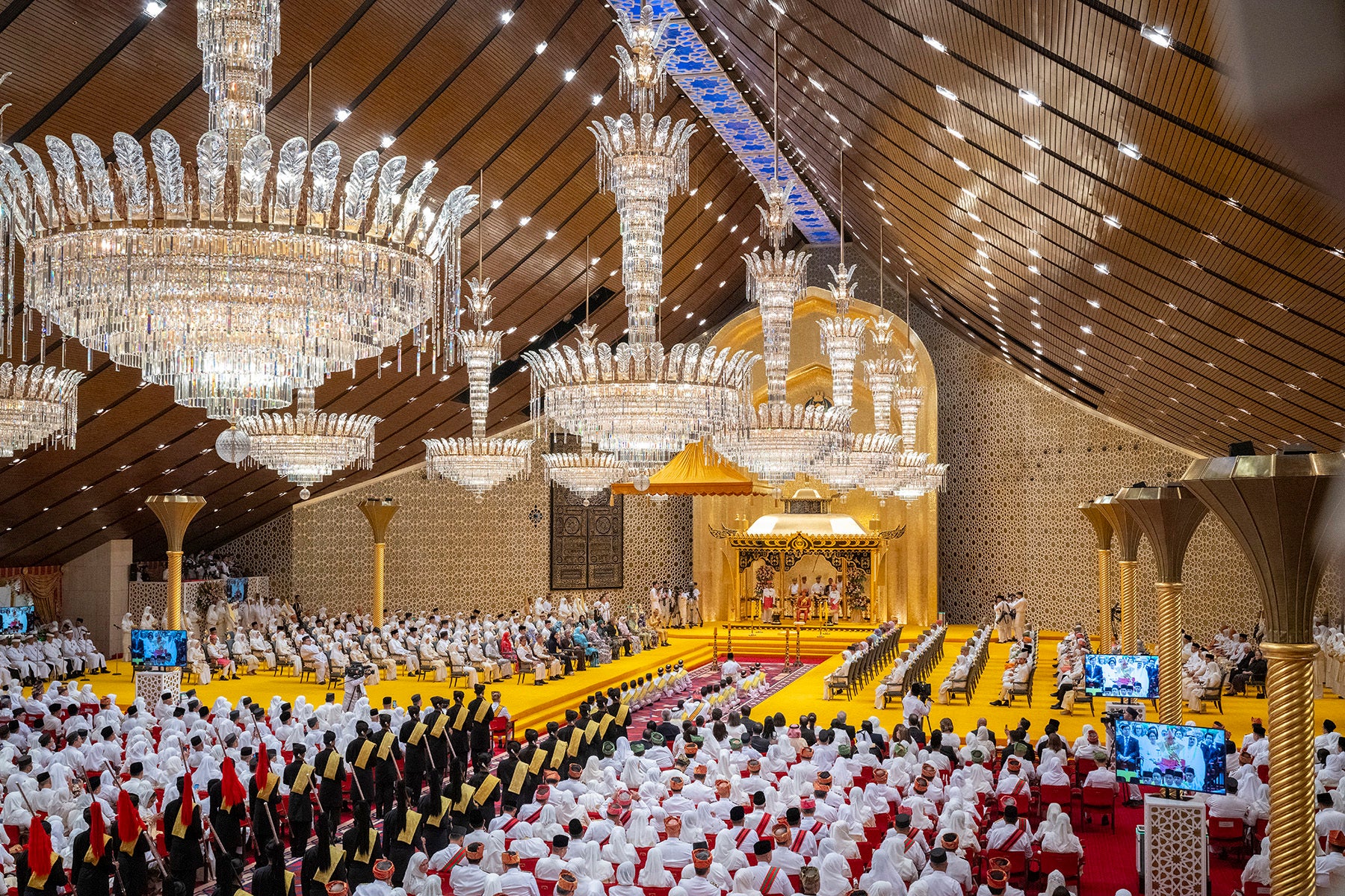 This picture taken by Brunei’s Information Department shows the royal powdering ceremony for Brunei's Prince Abdul Mateen's, centre, at Istana Nurul Iman, ahead of his wedding with Anisha Rosnah, in Bandar Seri Begawan, Brunei