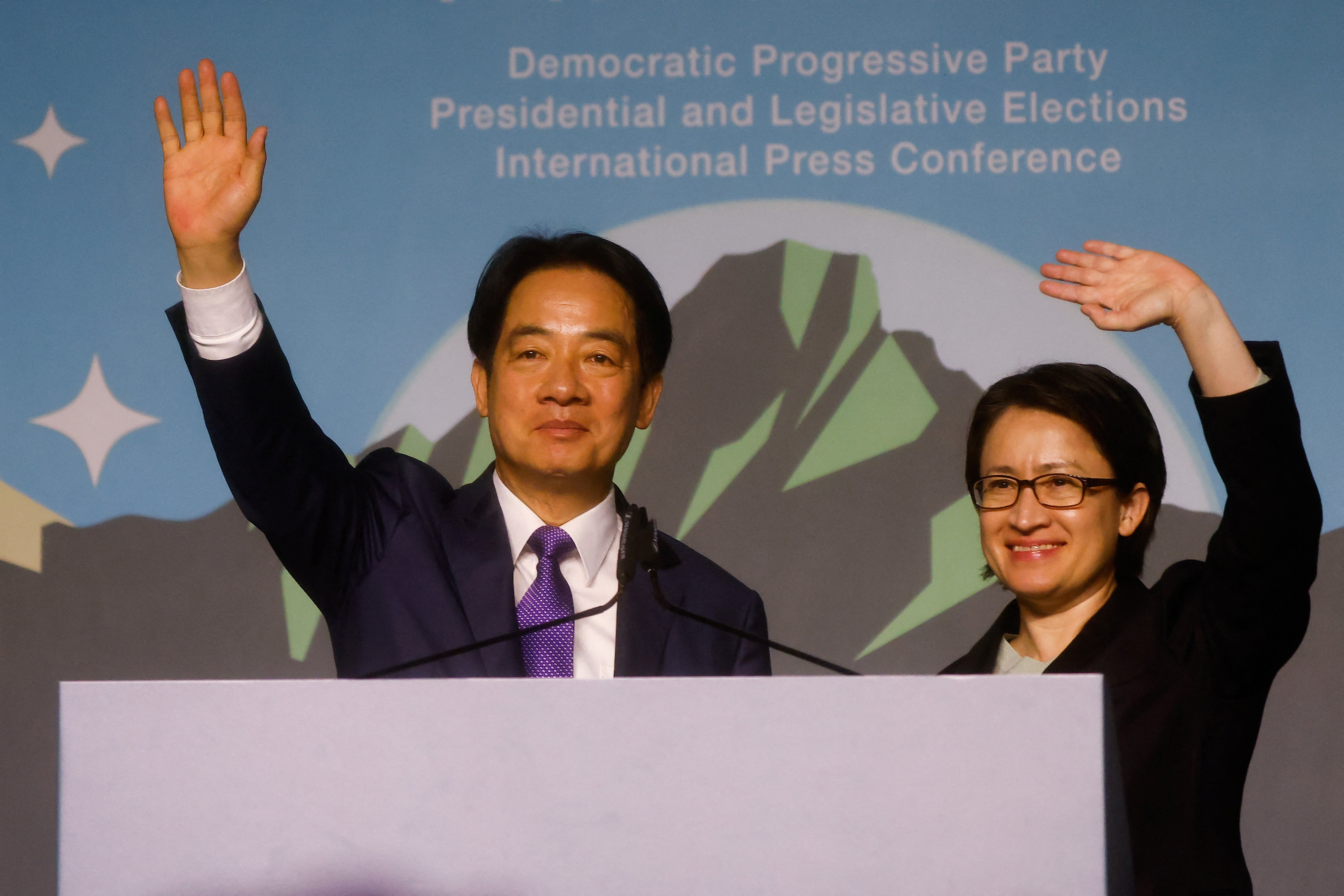 Taiwan President-elect Lai Ching-te, of Democratic Progressive Party's (DPP) and his running mate Hsiao Bi-khim wave as they hold a press conference