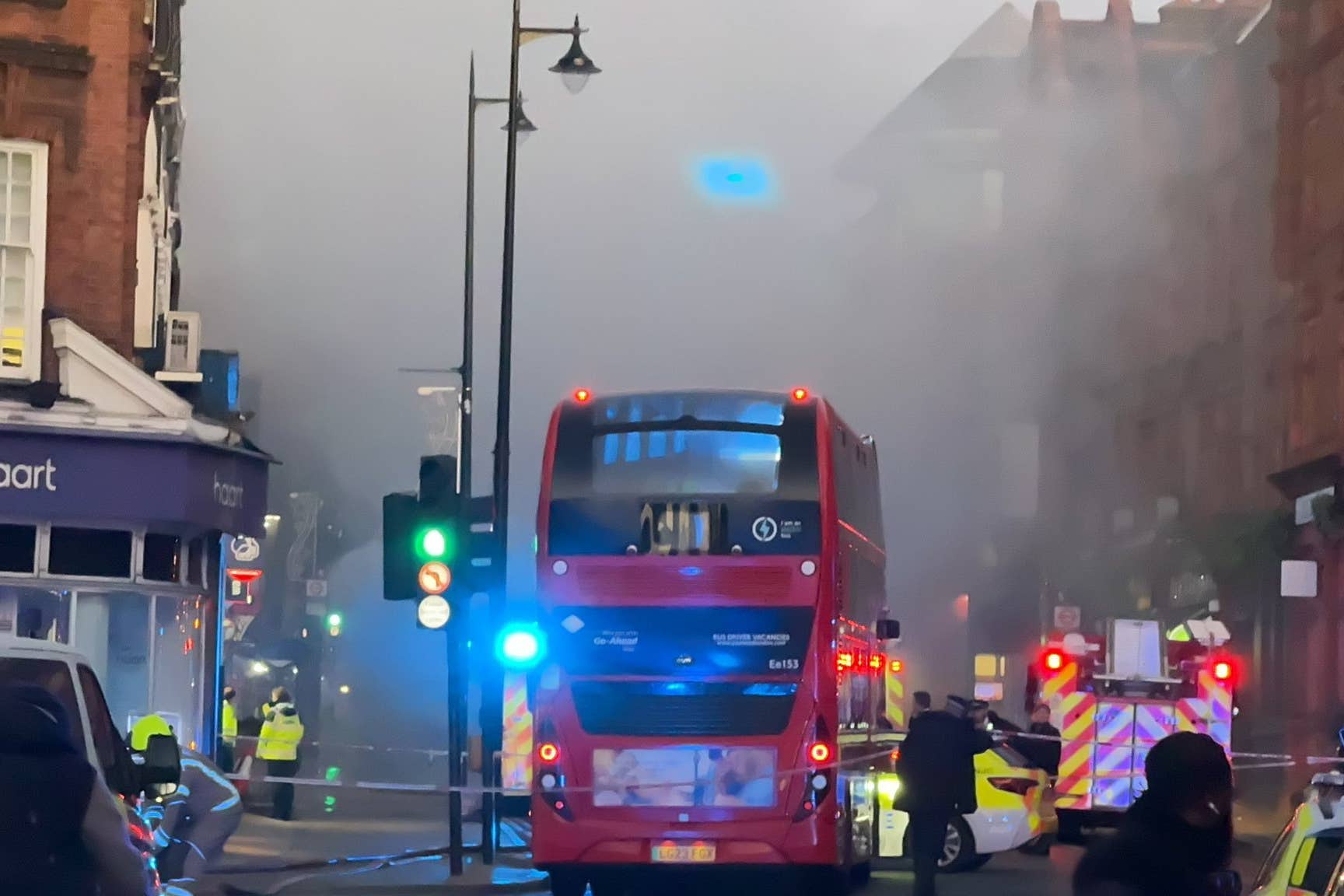 Three fire engines and around 15 firefighters attended the scene of the rush hour bus fire in Wimbledon on Thursday (@StevenW65432097/PA)