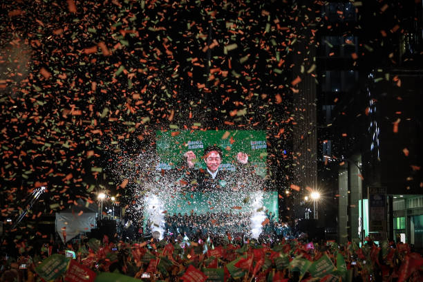 Confetti flies over the stage and the crowd as Taiwan’s president-elect Lai Ching-te speaks to supporters on Saturday