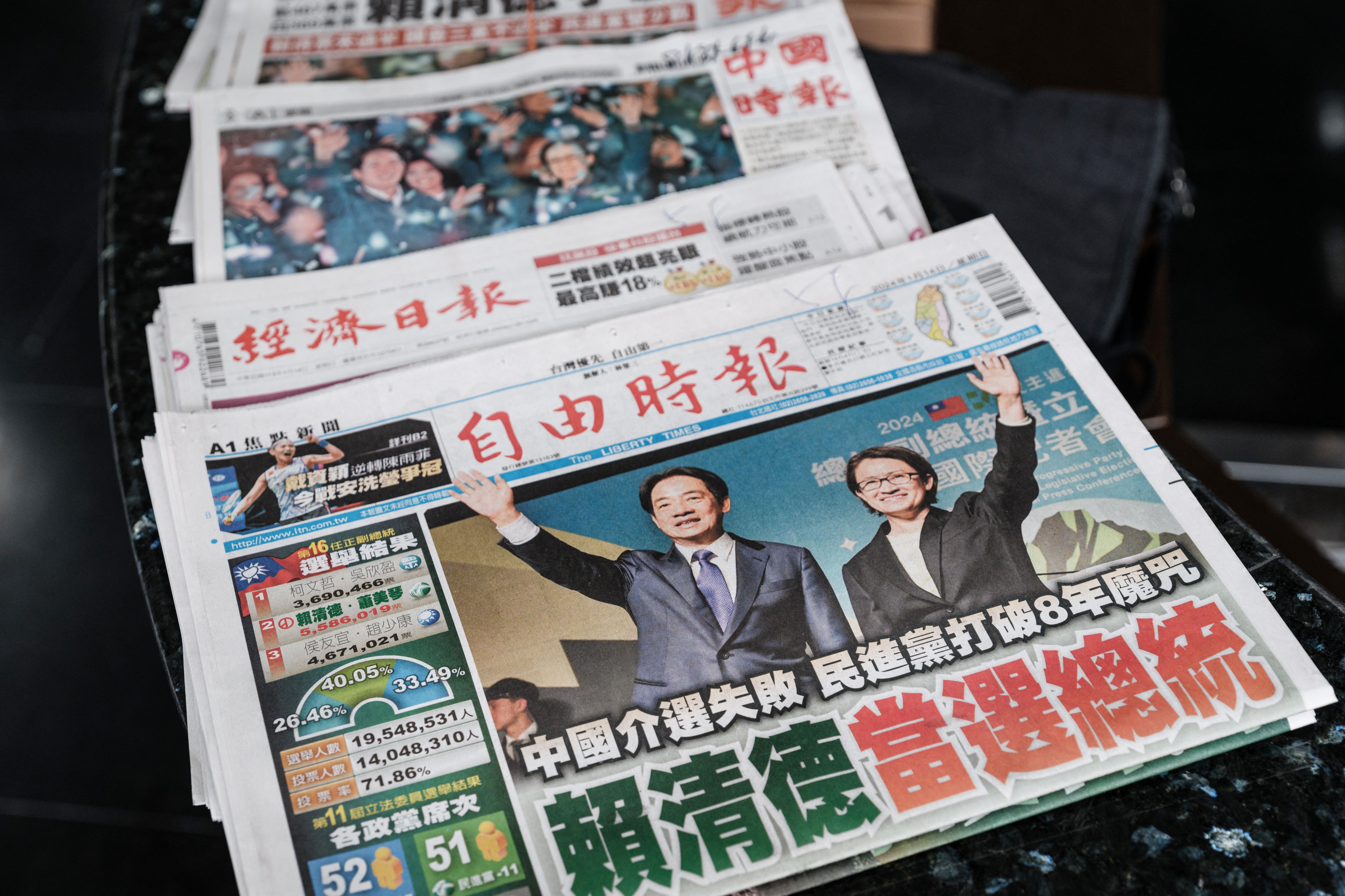 Local newspapers mark the ruling Democratic Progressive Party’s victory in the presidential election