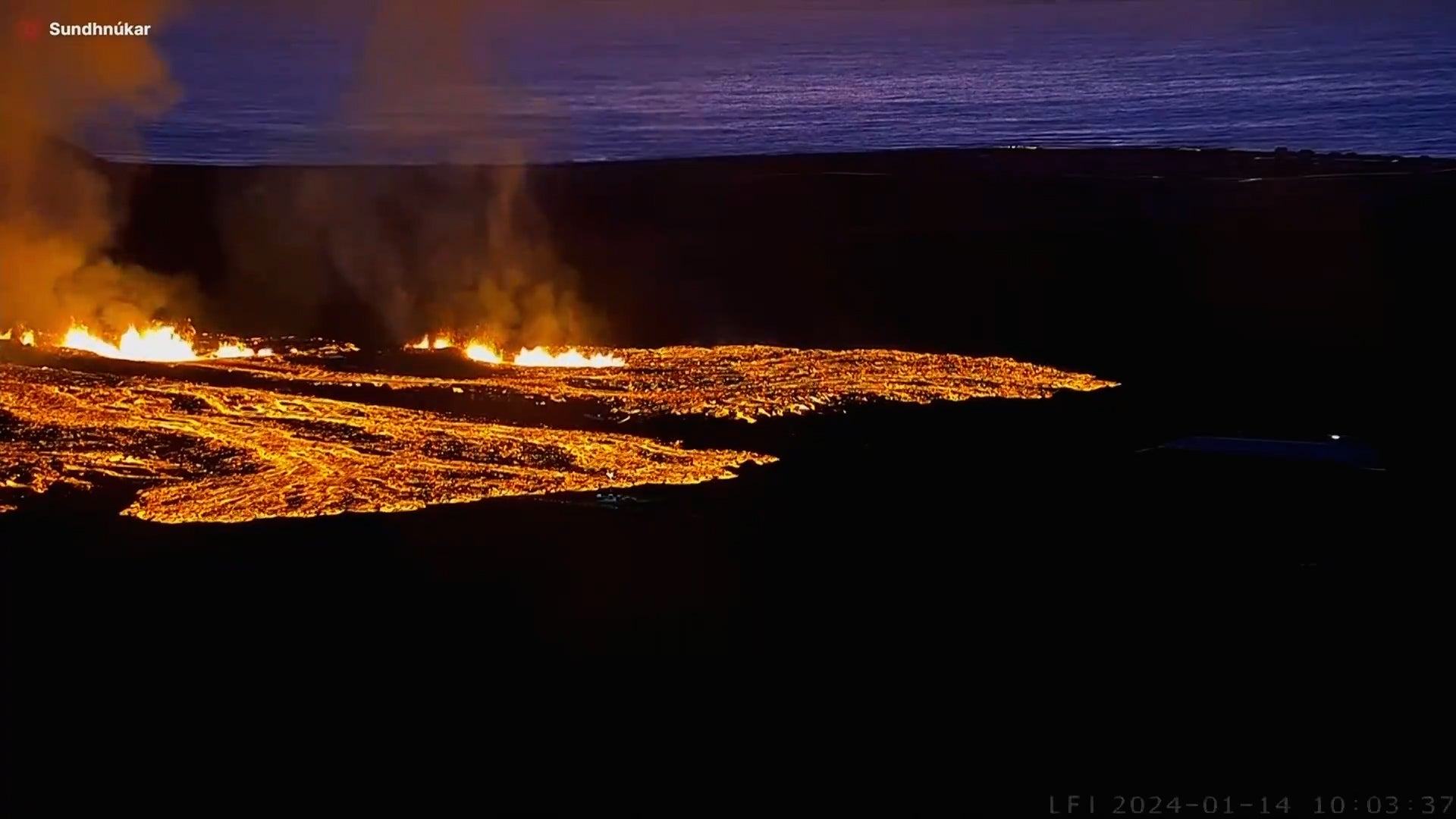 Lava dances around Iceland volcano as it erupts