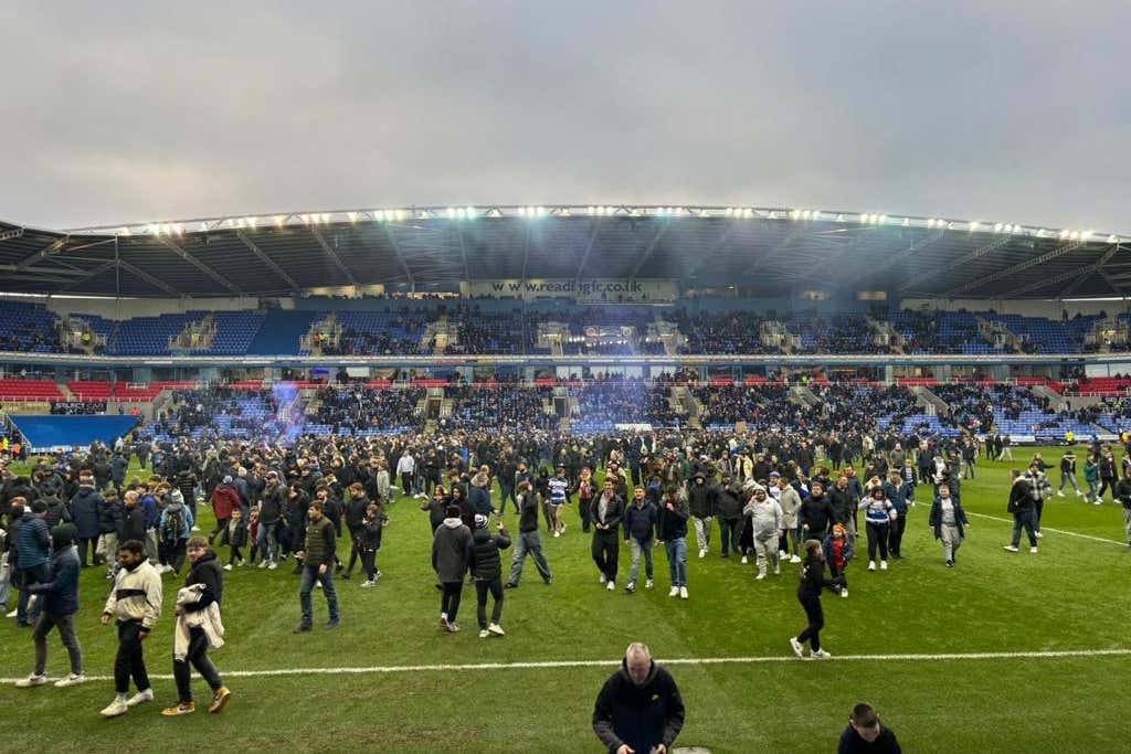 Protesting Reading fans invaded the pitch during their match against Port Vale, which had to be abandoned (Mark Mansfield/PA).