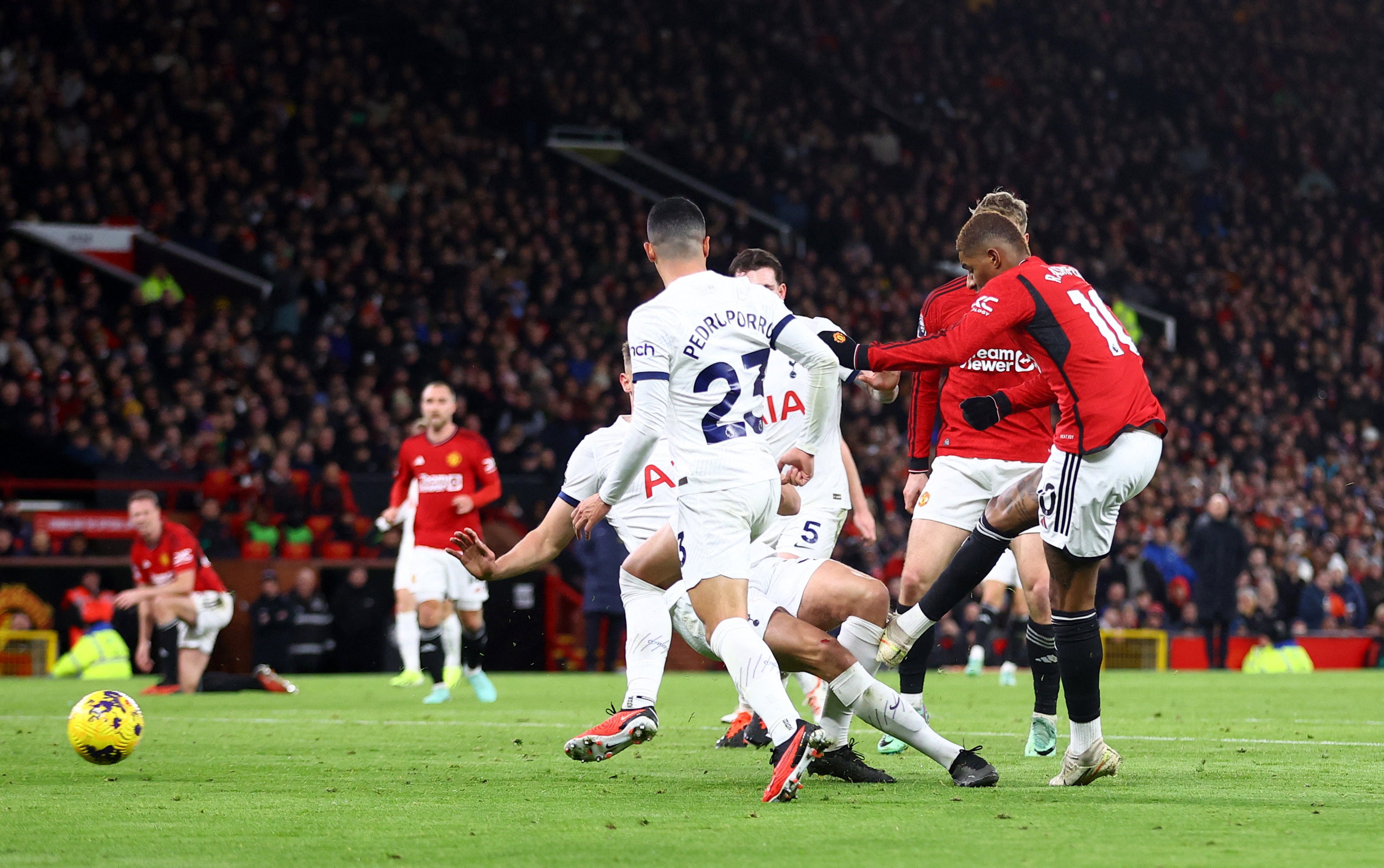 Marcus Rashford evades the crowd to score