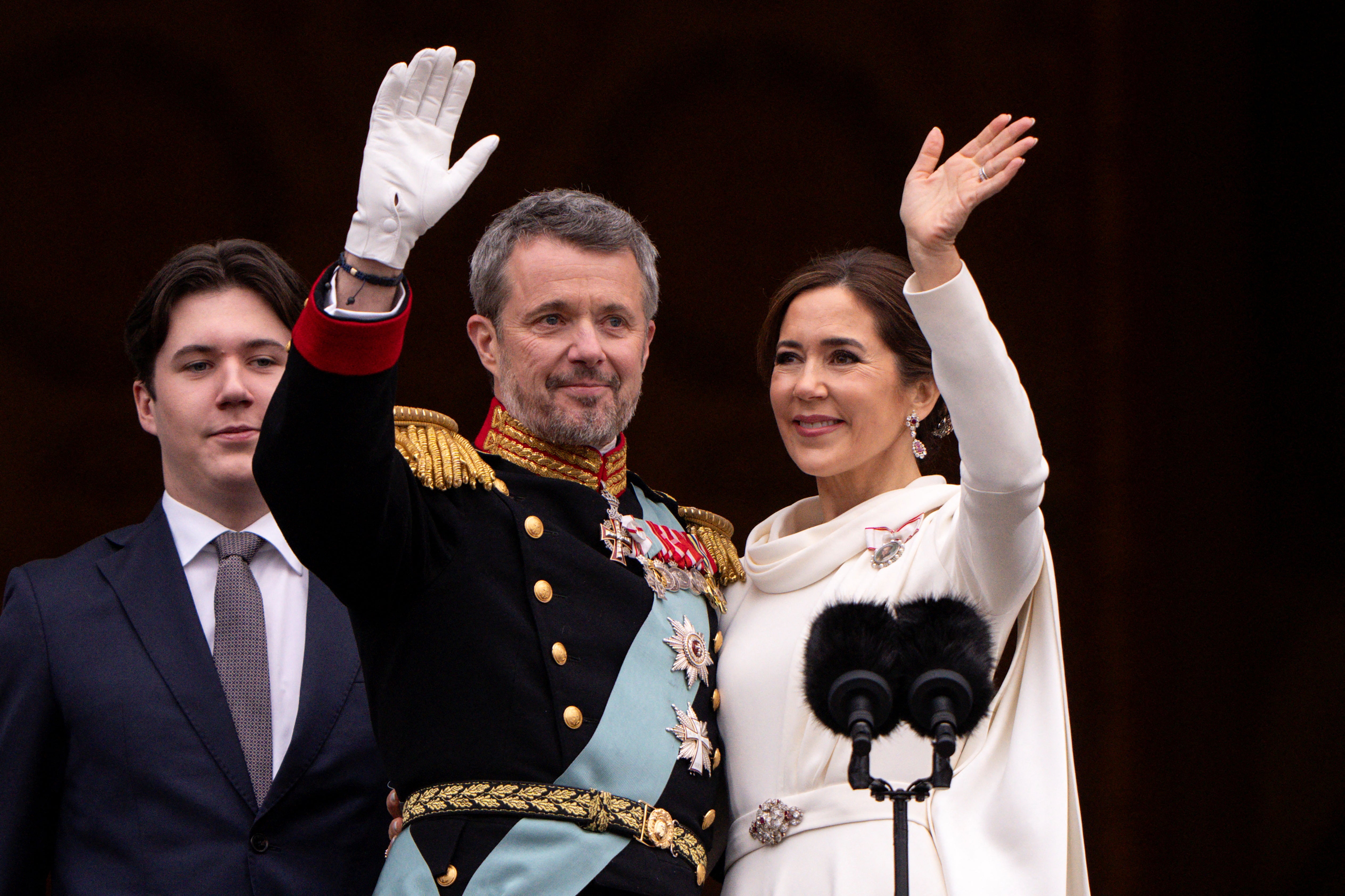 Denmark's newly proclaimed King Frederik and Queen Mary wave on the balcony of Christiansborg Palace