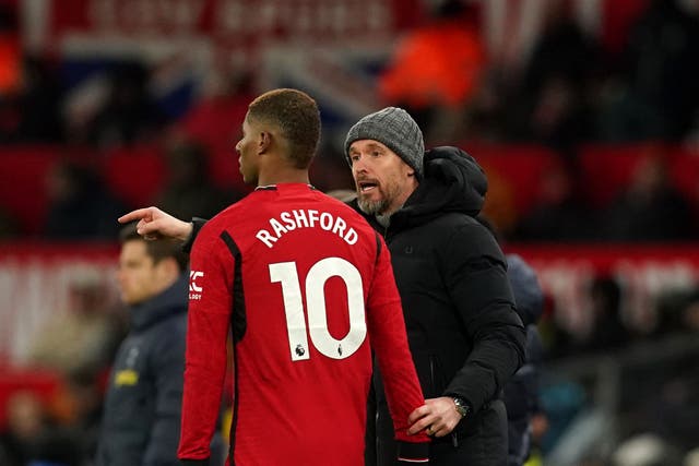 <p>Marcus Rashford with manager Erik ten Hag (Martin Rickett/PA)</p>