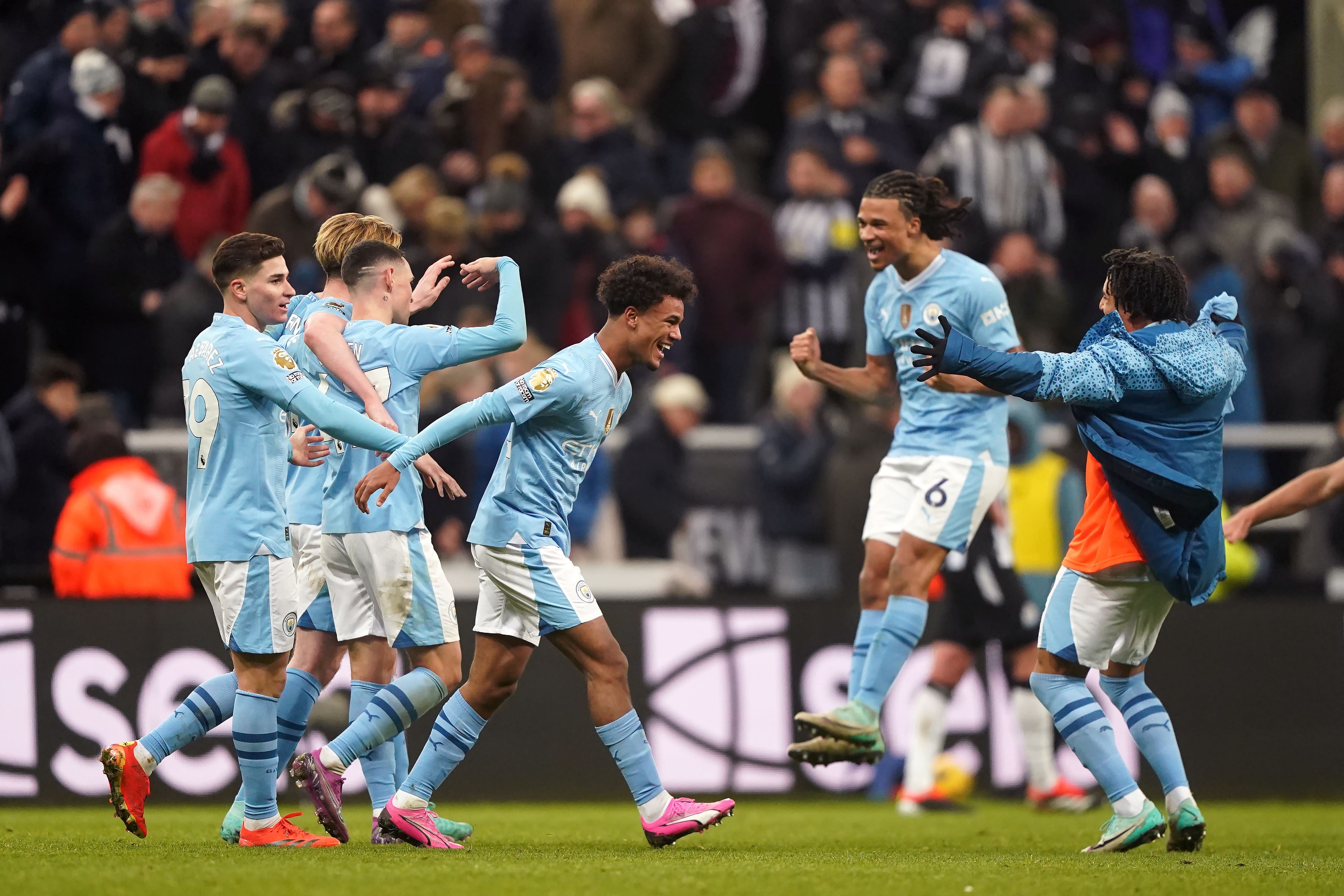 Manchester City’s Oscar Bobb celebrates scoring the winning goal at Newcastle (Owen Humphreys/PA)