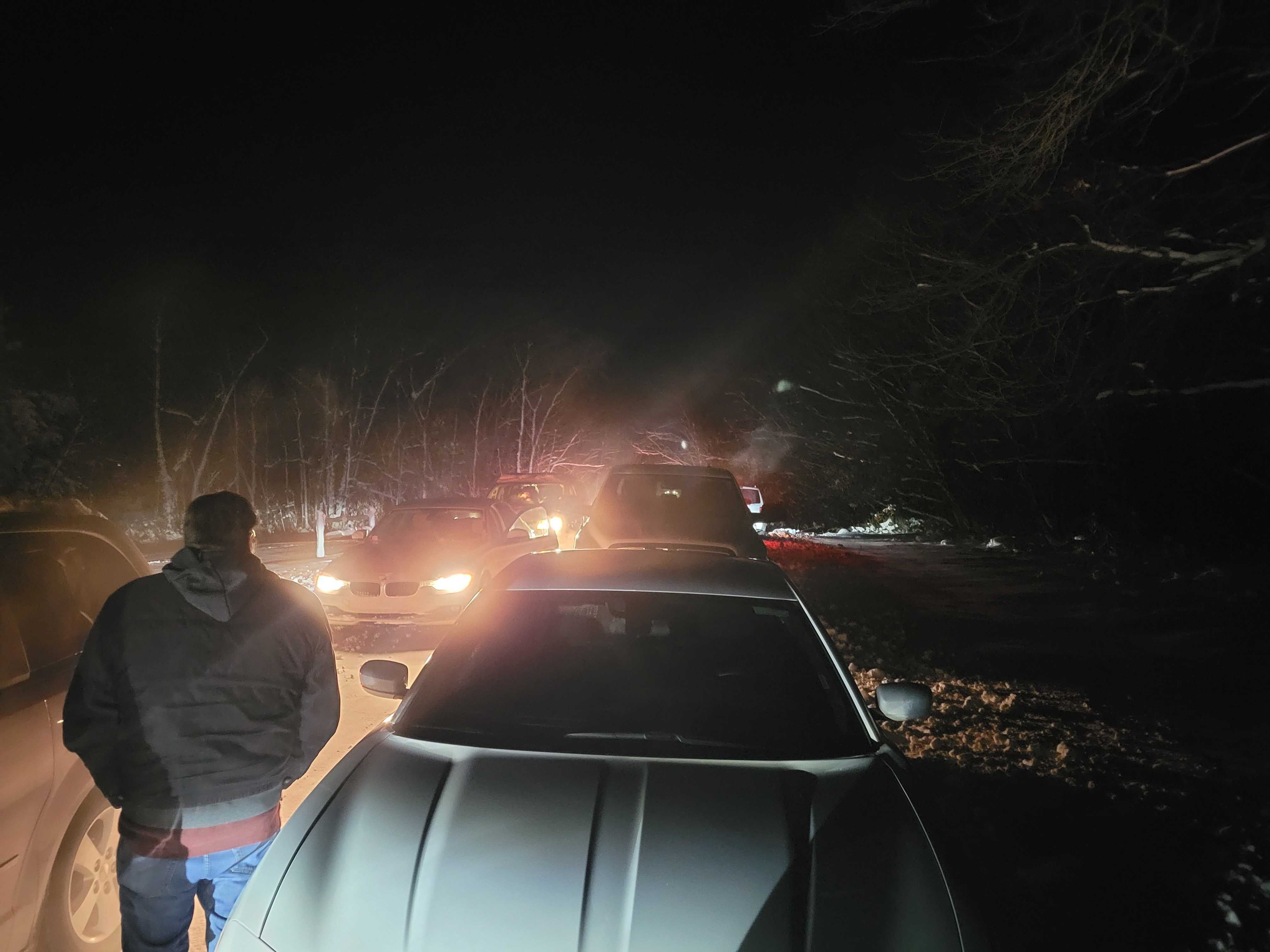 A man looks on helplessly outside of Nikki Haley’s event in Adel, Iowa, as two lines of unmoving vehicles block people from leaving or arriving