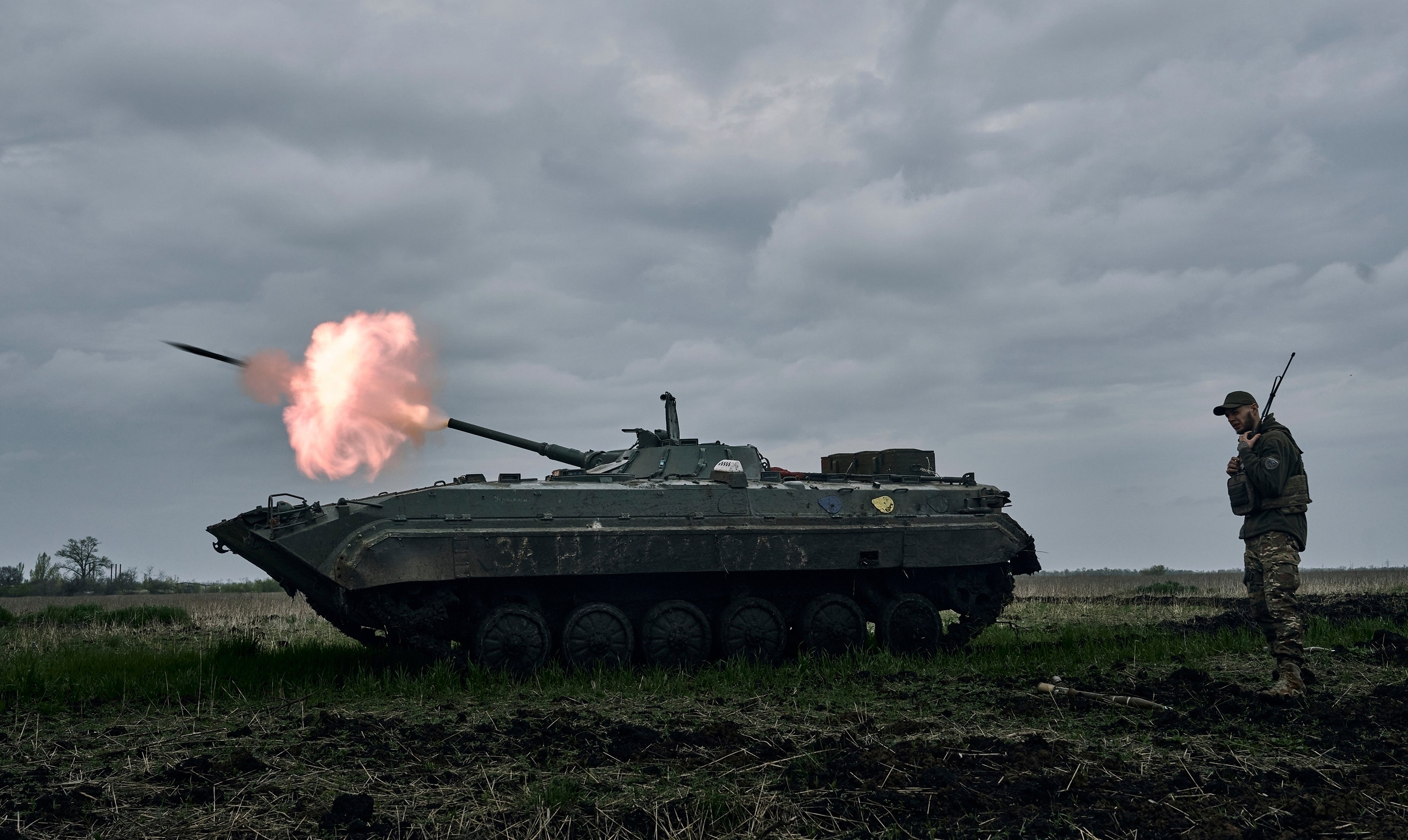 A Ukrainian soldier fires towards Russian positions near Avdiivka