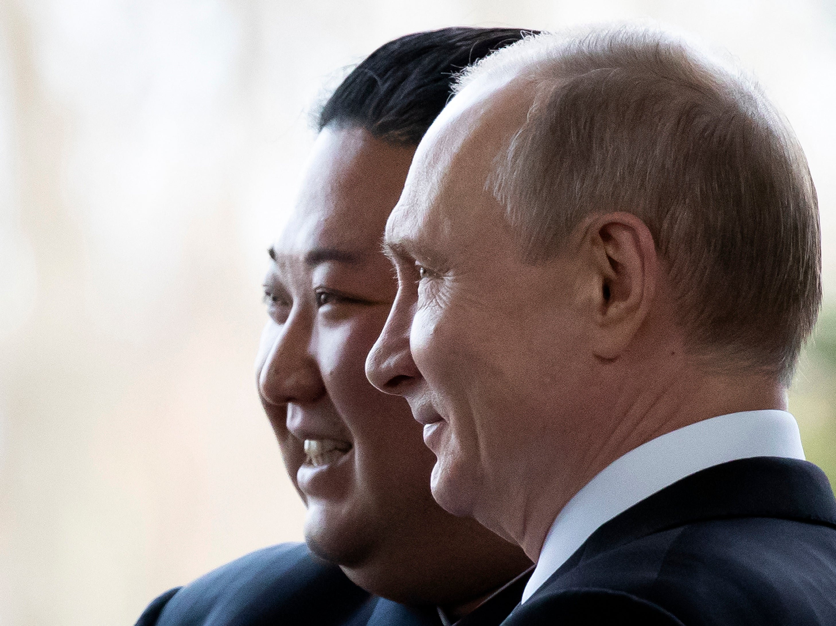 Russian President Vladimir Putin welcomes North Korean leader Kim Jong Un prior to their talks at the Far Eastern Federal University campus on Russky island in the far-eastern Russian port of Vladivostok in 2019