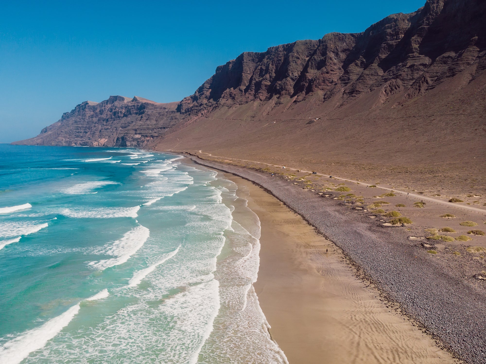 Surf-battered Famara is renowned for riding the waves