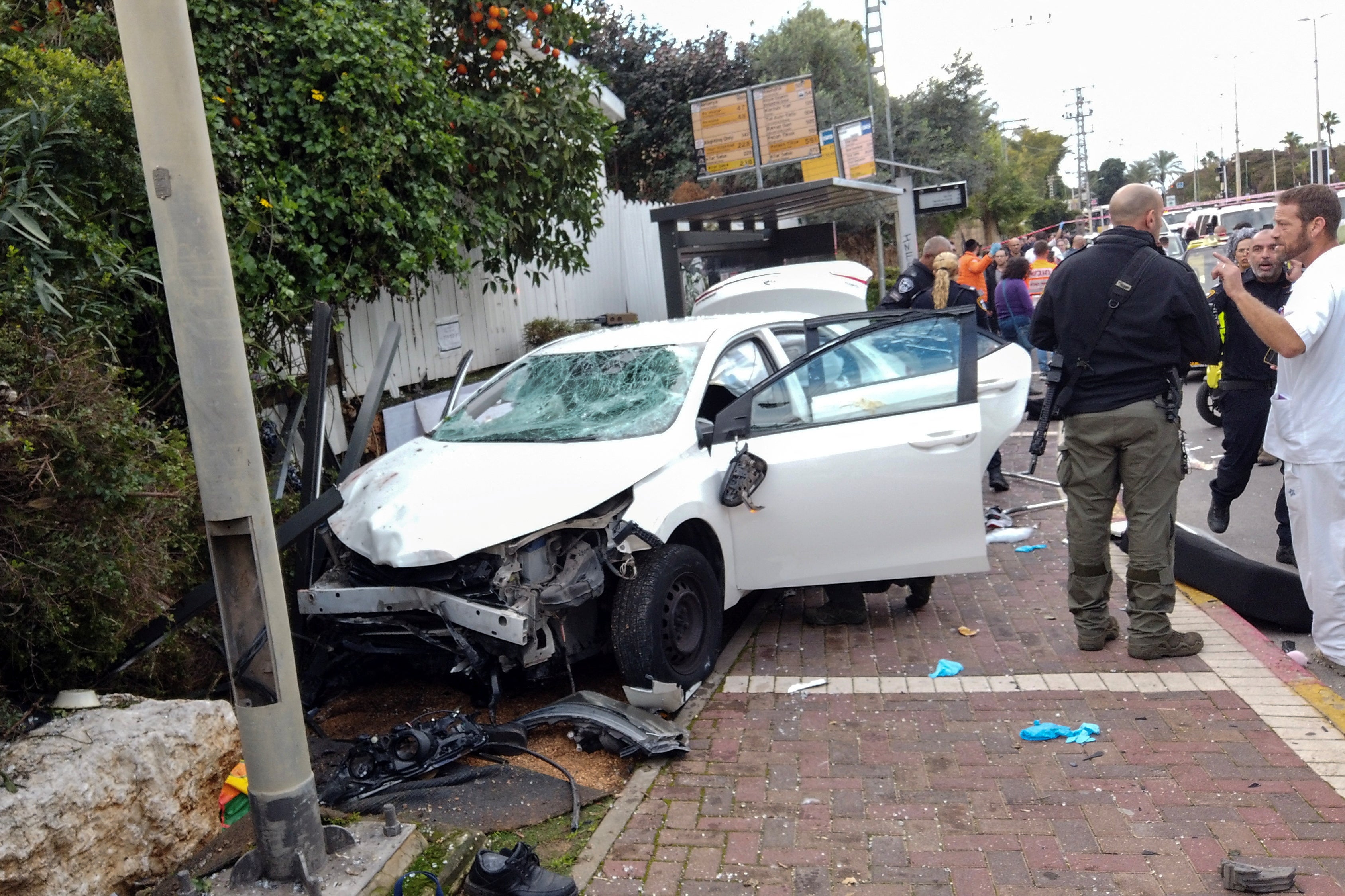 Israeli security officials respond to the suspected ramming attack in Raanana which has left more than 19 people injured