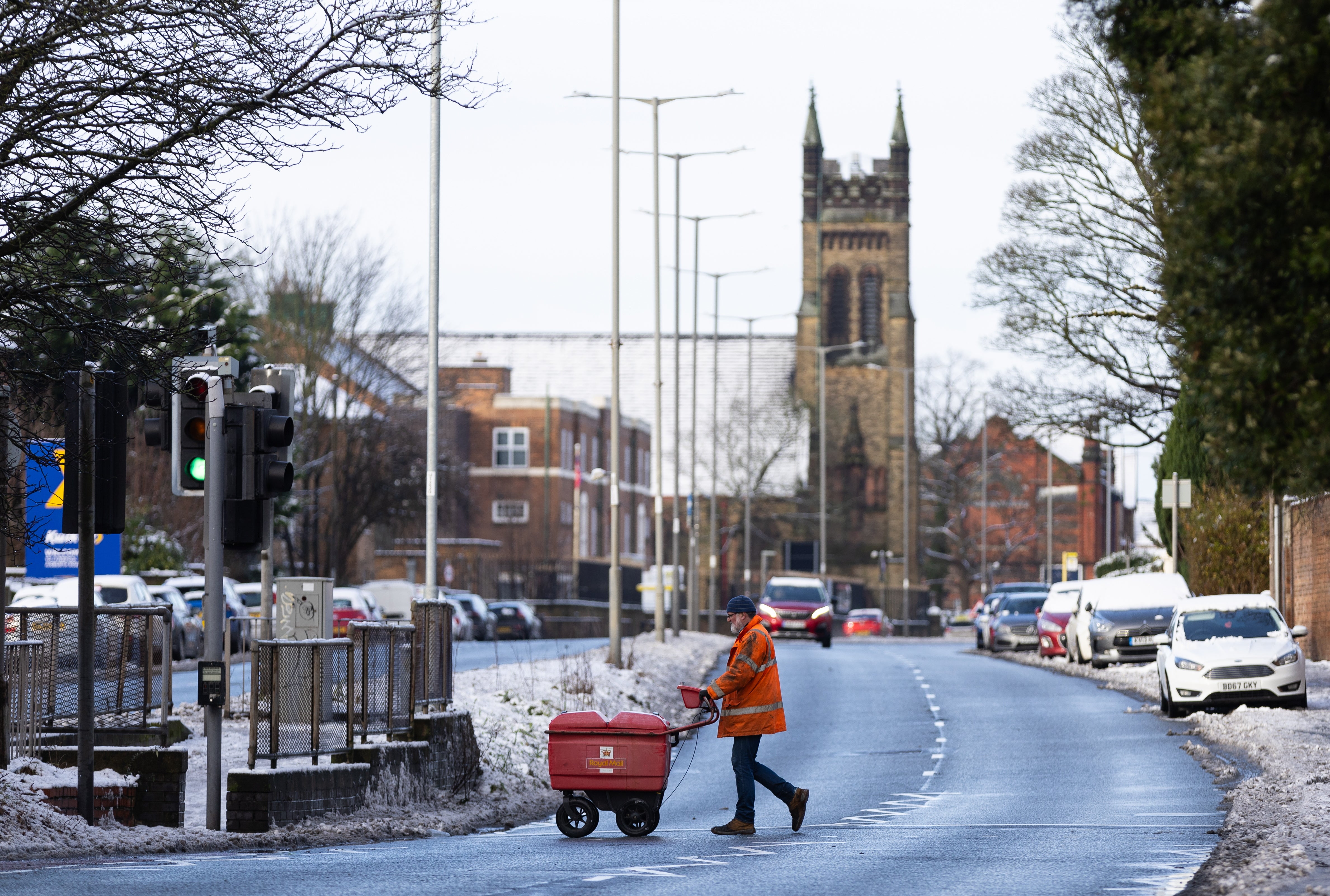 A postal worker in Liverpool, January 2024