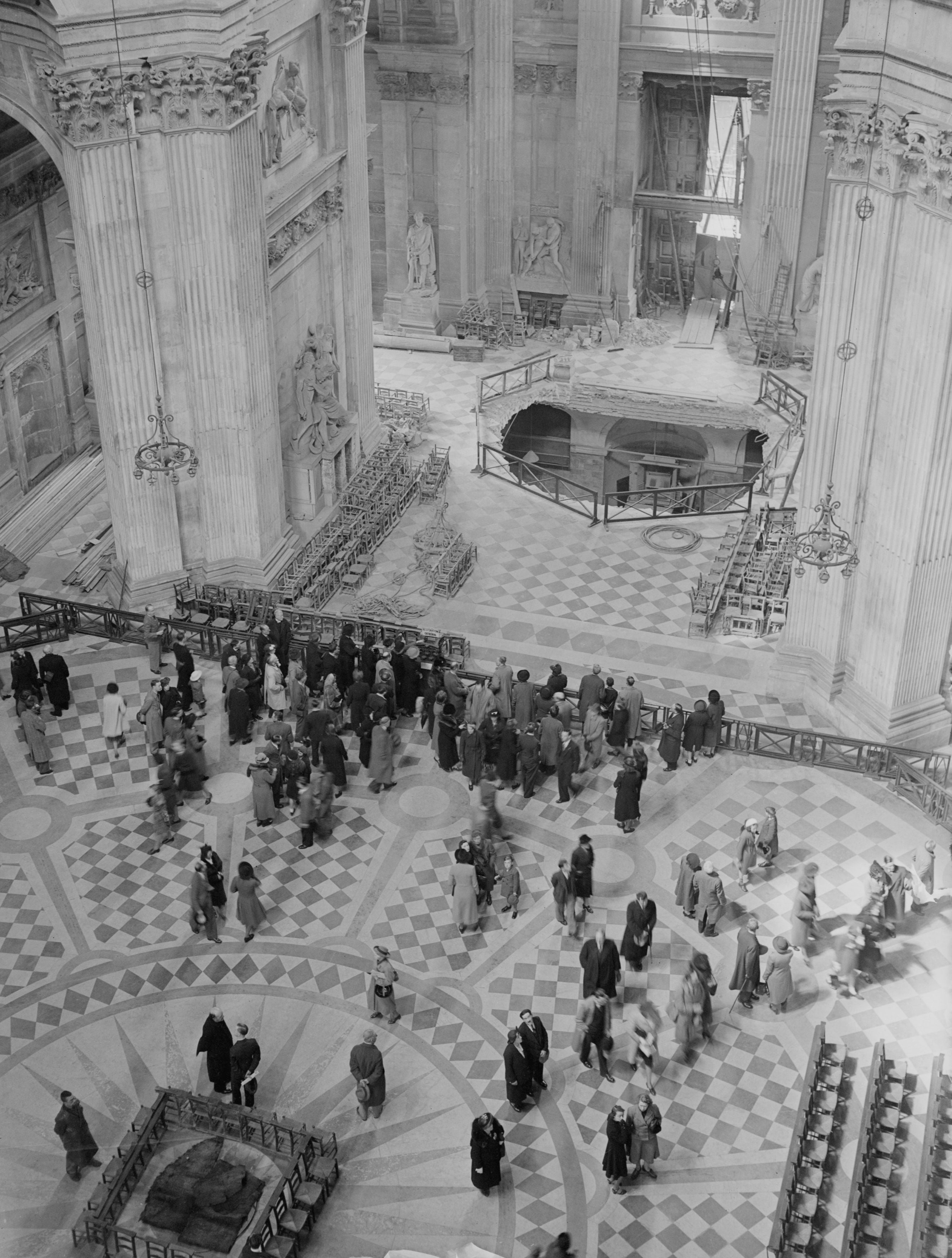 Visitors to St Paul’s Cathedral, London, survey the bomb damage in 1941