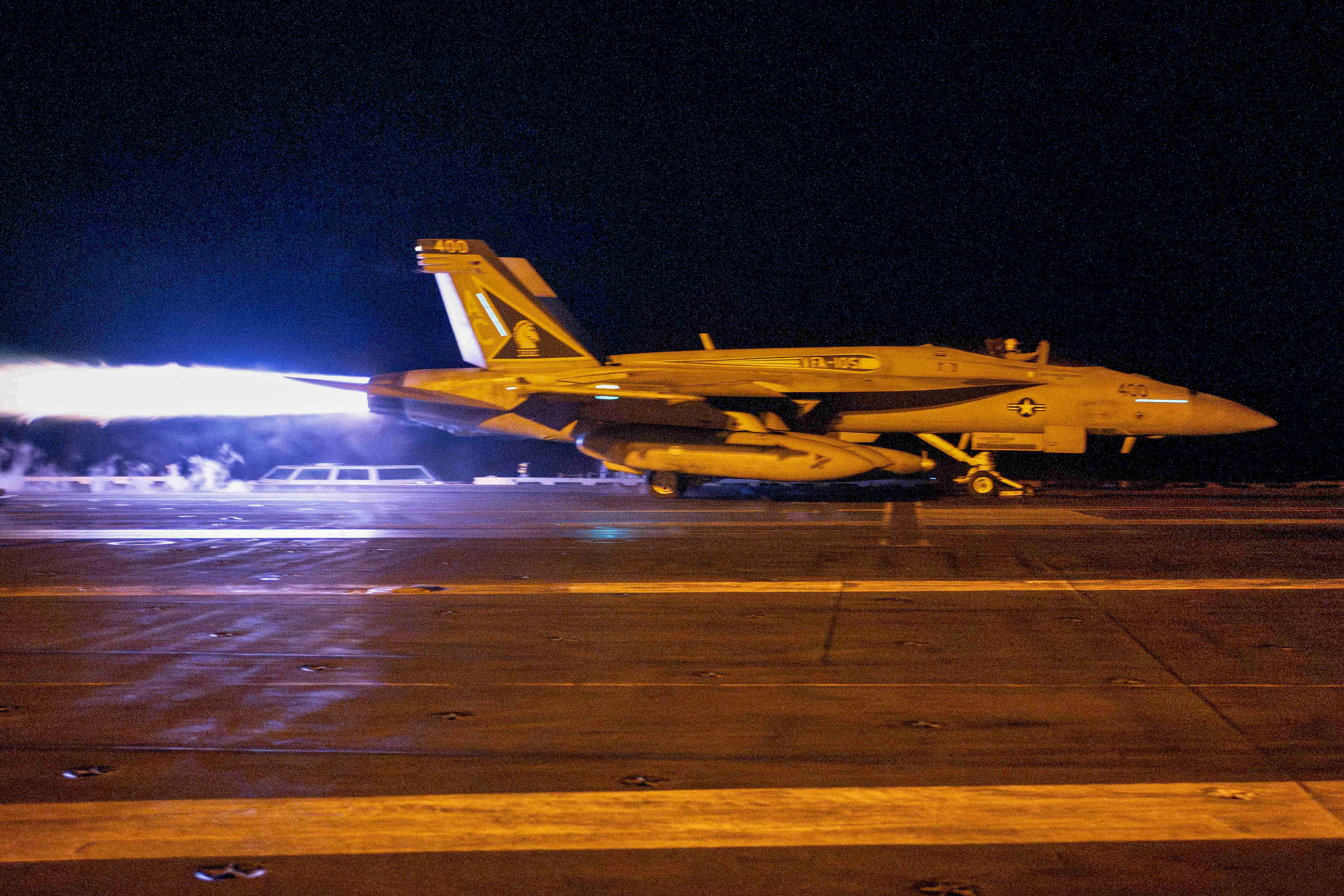 A fighter jet taking off from USS Dwight D. Eisenhower (CVN 69) during flight operations in response to increased Iranian-backed Houthi attacks on ships in the Red Sea