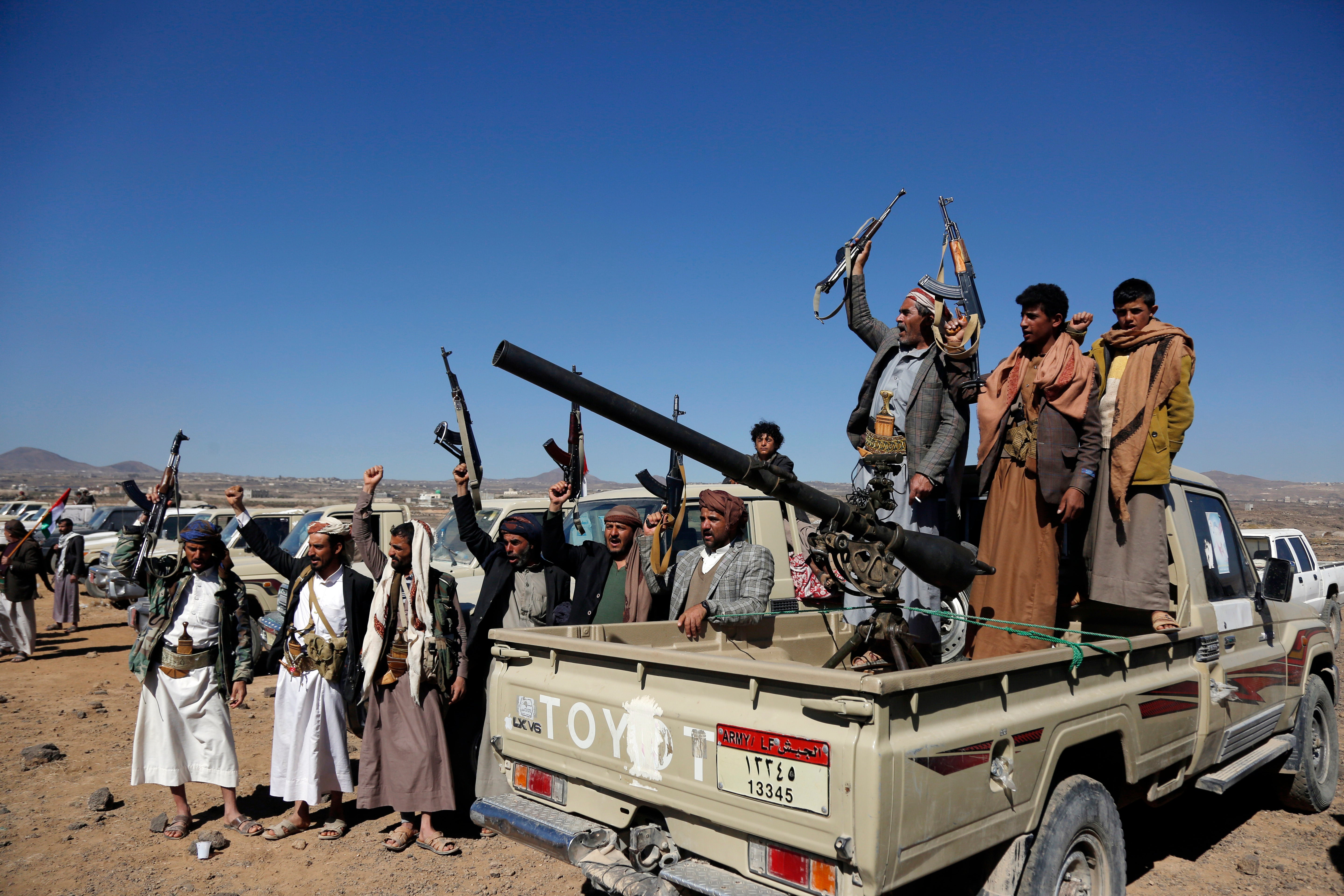 Houthi fighters and tribesmen stage a rally against the US and the UK strikes on Houthi-run military sites near Sanaa, Yemen, in January