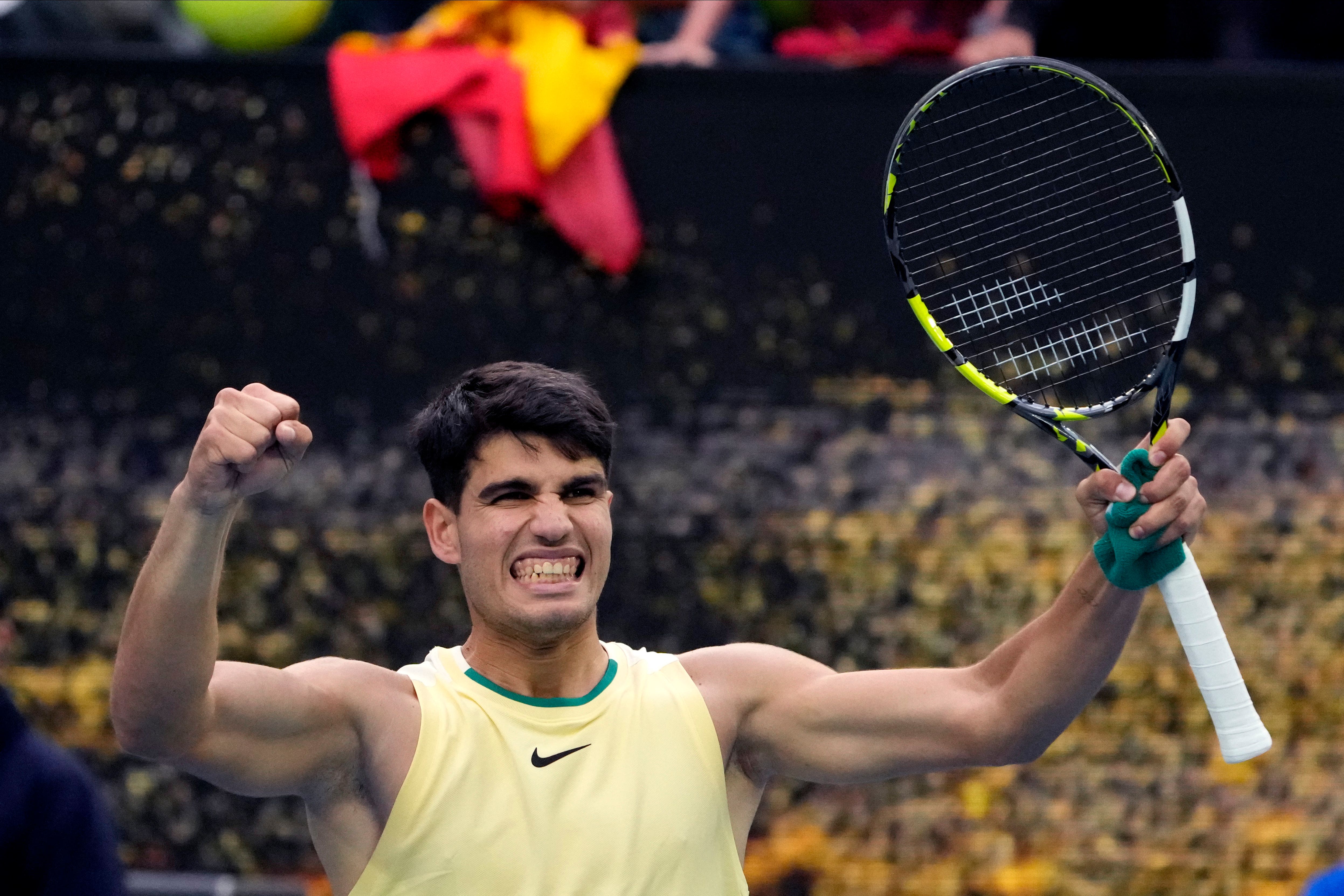 Carlos Alcaraz celebrates after defeating Lorenzo Sonego (Andy Wong/AP)