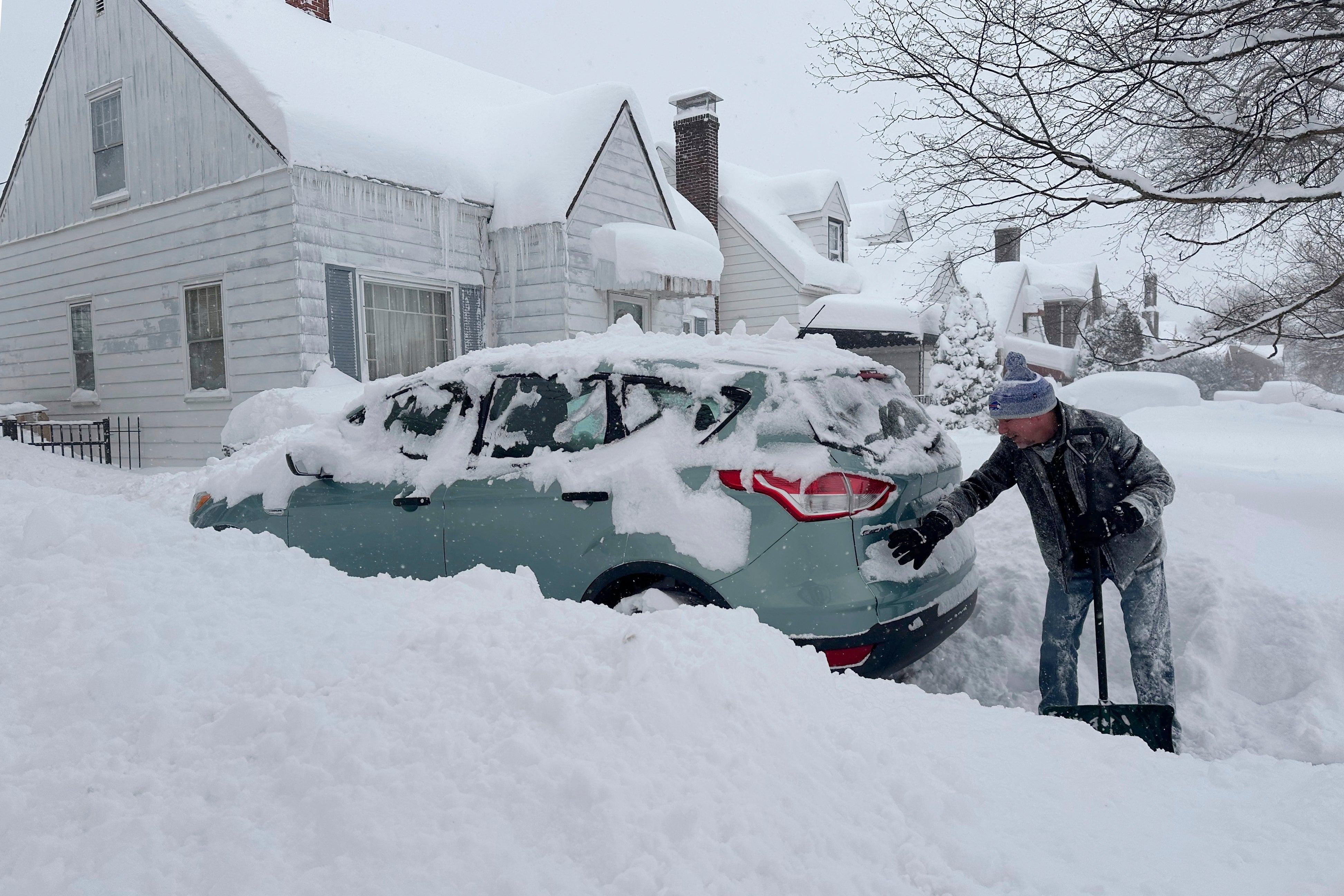 Patrick Sahr shovels snow in Buffalo, N.Y