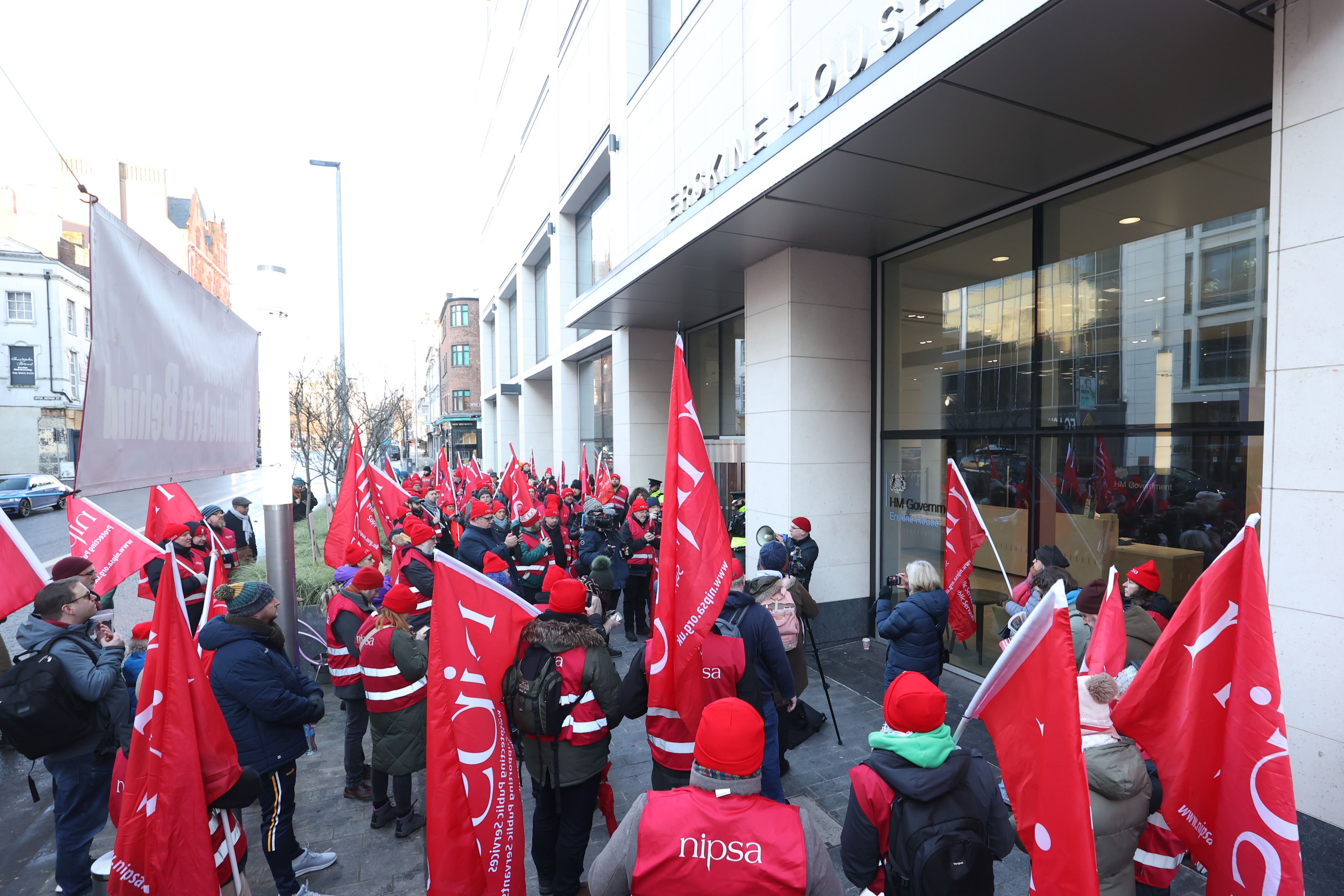 Public sector workers from Northern Ireland Public Service Alliance (NIPSA) on the picket line outside the Northern Ireland Office (NIO) at Erskine House, Belfast (Liam McBurney/PA)